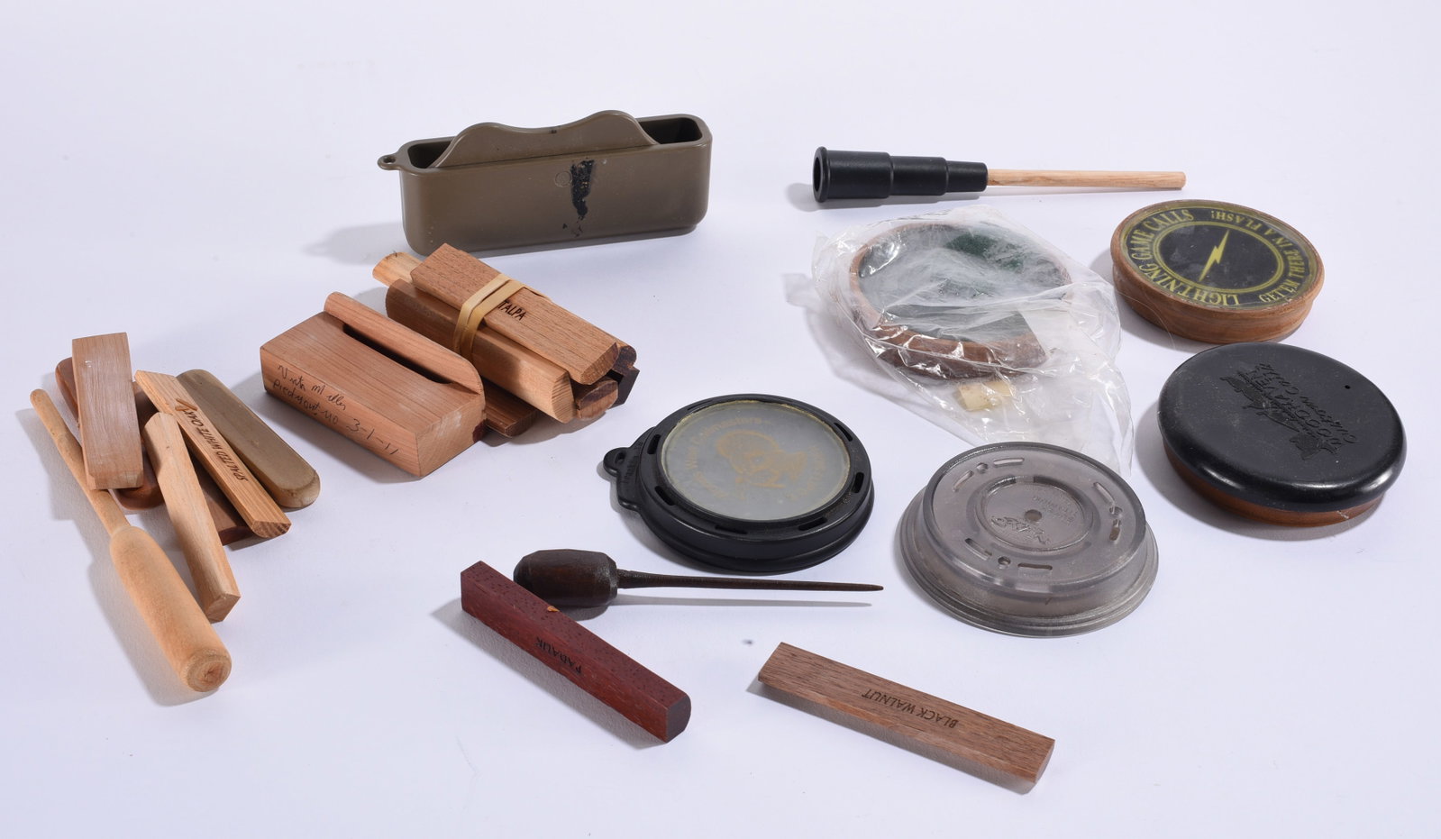 Large Collection of Vintage Turkey Calls & Accessories: Largest 6"x3" Large assorted collection of turkey and game calls and accessories including wooden box calls, pot calls, striker calls and related calling components. Visible examples include wood spec