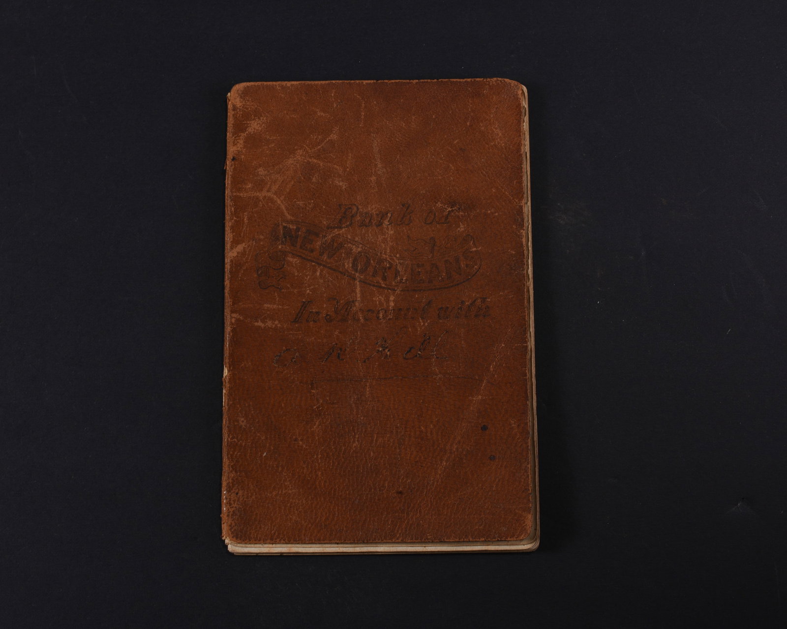 New Orleans Bank Journal with Geneological Information: Bank journal for the “Bank of New Orleans” kept for A.D. Hill in 1855. Leather cover, approximately 40pp 4”x6” . Though this is a bank ledger book , it appears to not be used for t