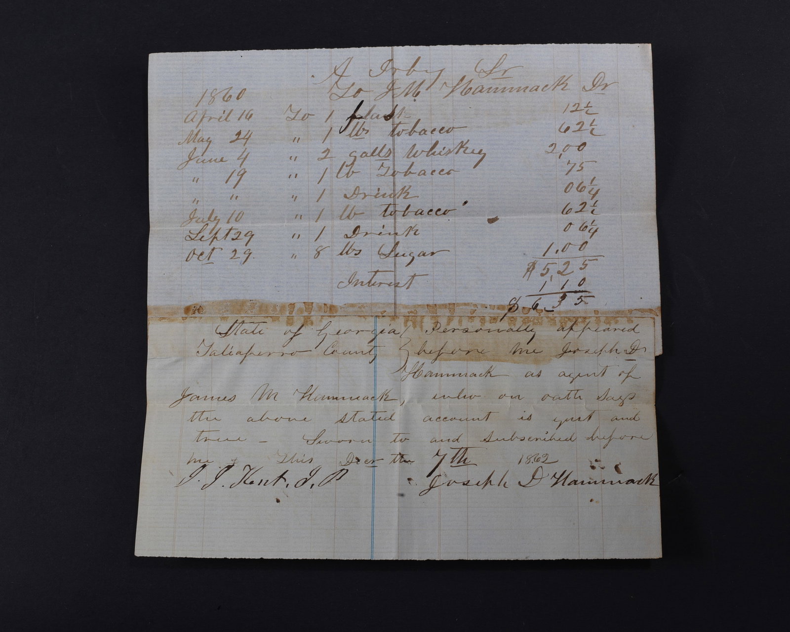 Confederate Whiskey and Tobacco: Confederate Manuscript Document Signed by Joseph Hammack, 1pp quarto, December 7, 1862, pertaining to a bill owed by Abraham Irby including whiskey and tobacco. Good condition.