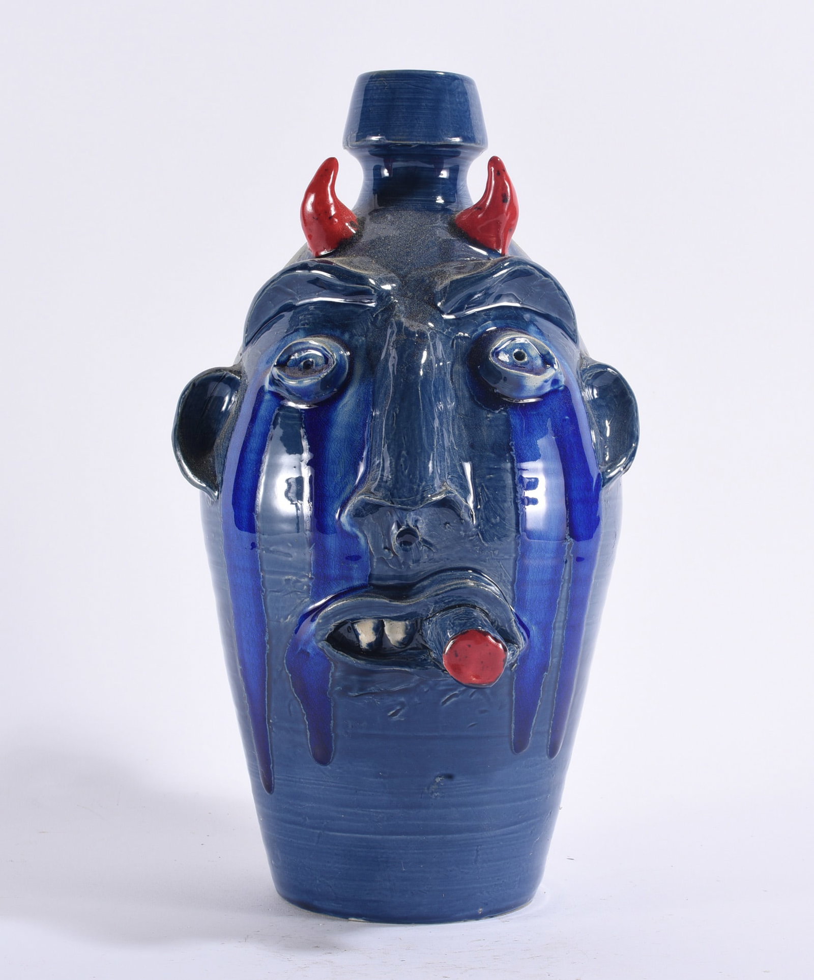 Randy Tobias Face Jug: Randy Tobias North Carolina folk pottery devil face jug, wheel-thrown with tall cylindrical form and expressive applied features including red horns, heavy eyebrows, ears, large eyes, elongated nose a