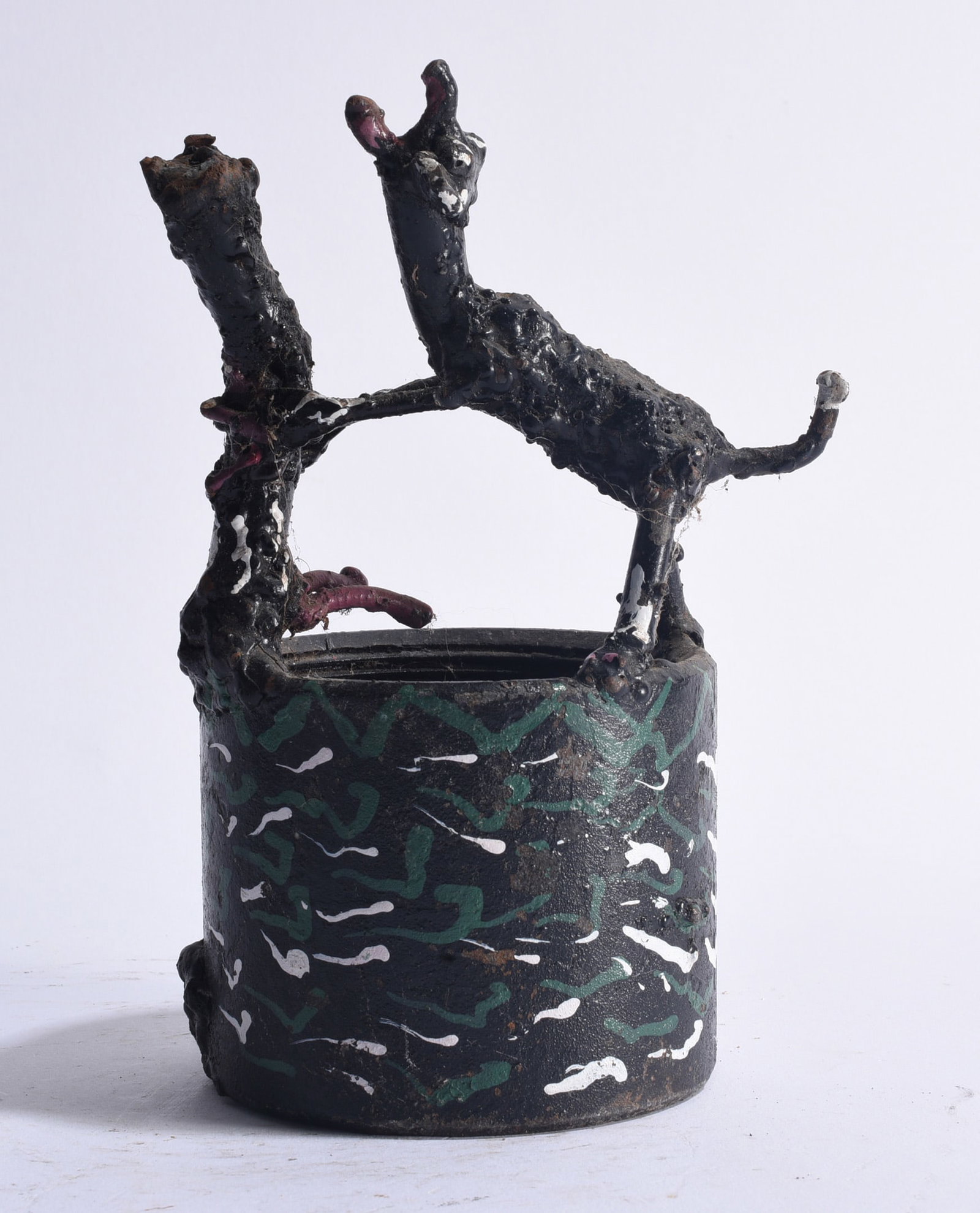 Willie Tarver (1932 - 2010) Sculpture: Mixed-media folk sculpture by Willie Tarver (1932–2010), fashioned from found and repurposed materials and depicting two animated animal-like figures interacting atop a cylindrical base. The roughly