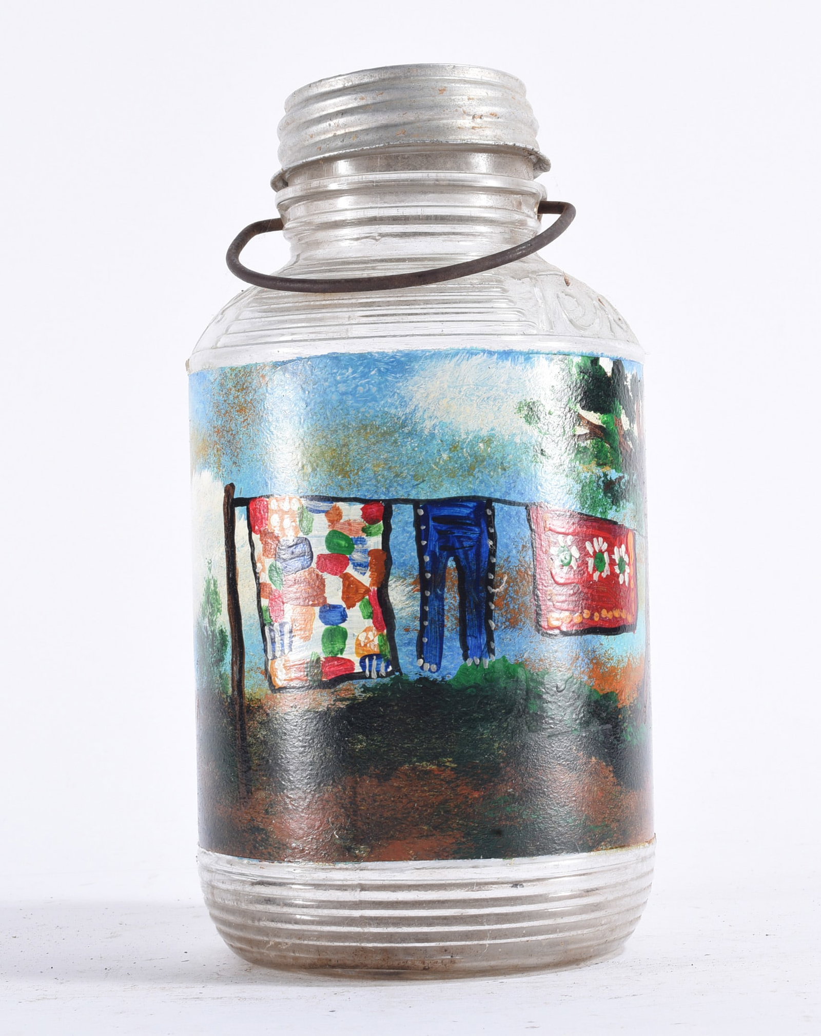 Richard Roebuck Painting on Glass Jar: Hand-painted glass jar by Richard E. Roebuck featuring a large rooster surrounded by trees and landscape imagery. Richly painted in earthy browns, greens, and blues with the imagery extending around t