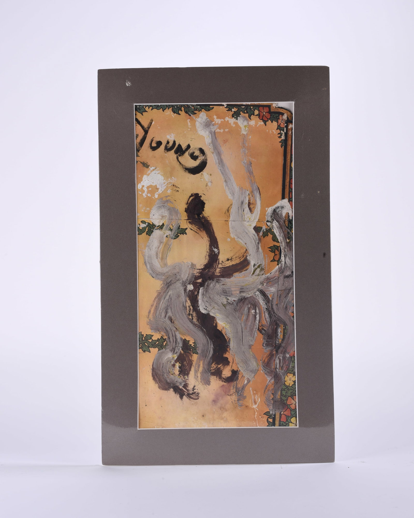 Purvis Young (1943-2010): Purvis Young (1943-2010), executed on found paper or board and presented under matting. The composition features energetic gestural figures rendered in gray, white and dark brown over a printed