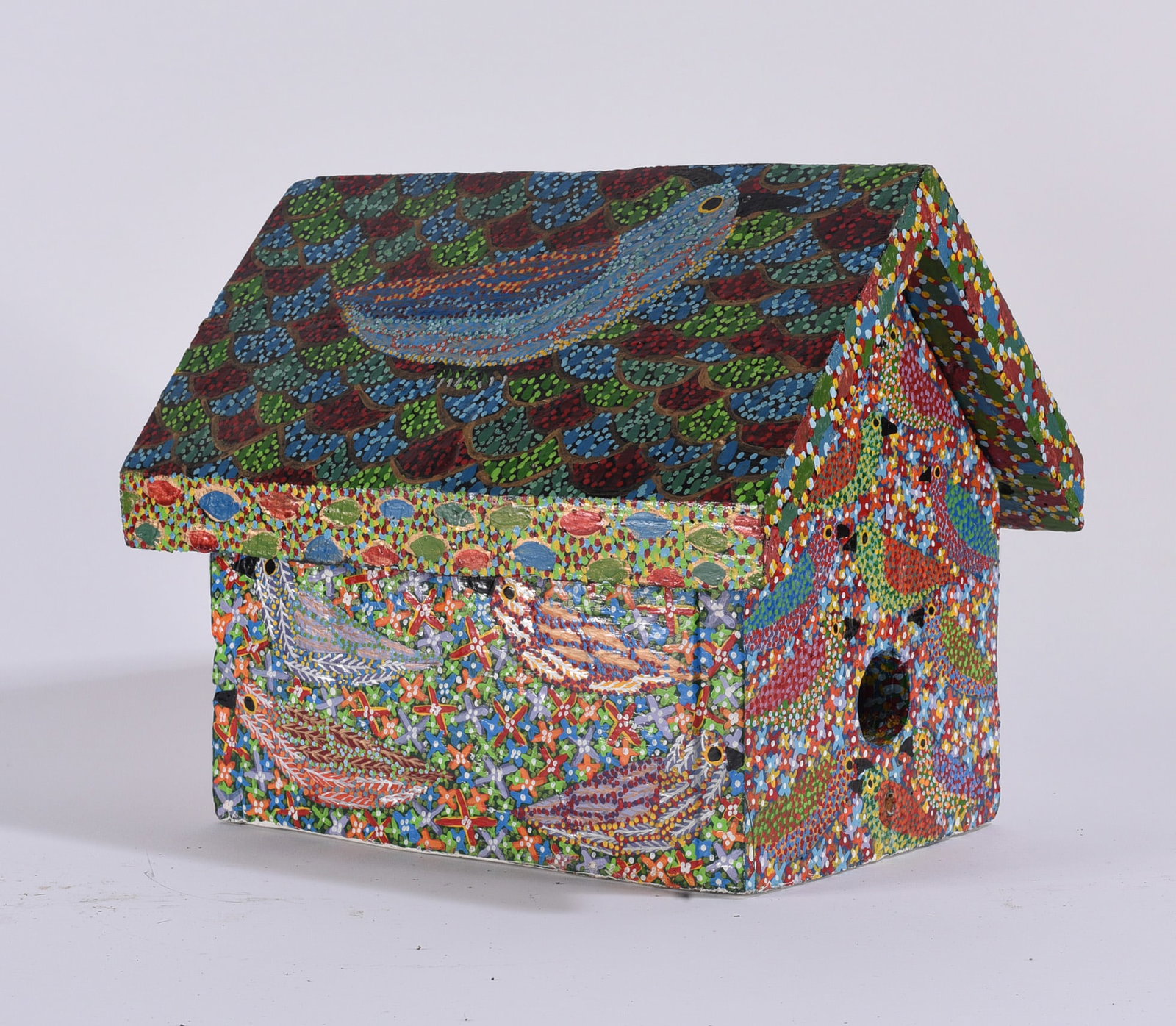 Jeff Payne Folk Art Painted Bird House: Painted wooden birdhouse by folk artist Jeff Payne, elaborately decorated across all surfaces with dense pointillist patterns, stylized birds, flowers, and colorful geometric motifs. The pitched roof 