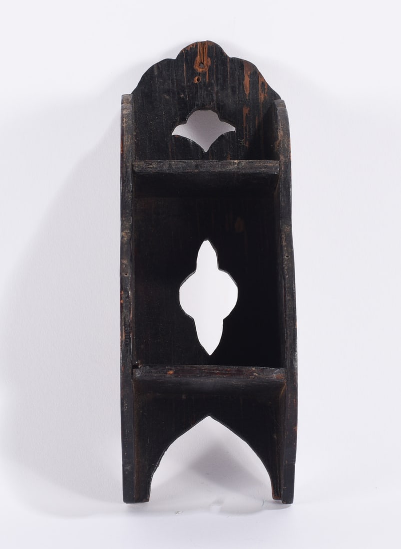 Primitive Folk Art Candle Box: Primitive wooden candle box or wall box with dark painted surface, tall narrow form, open shelves, shaped crest, decorative pierced cutouts, and arched lower opening. The worn painted surface and