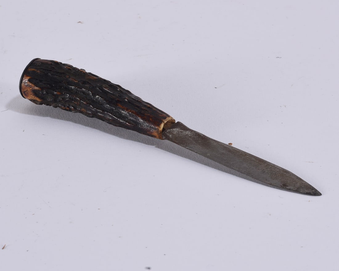 Antique Oyster Knife with Stag Handle: Antique oyster knife featuring a forged steel blade with pointed profile and substantial natural stag antler handle. The blade retains an aged darkened surface and patina, while the textured antler gr