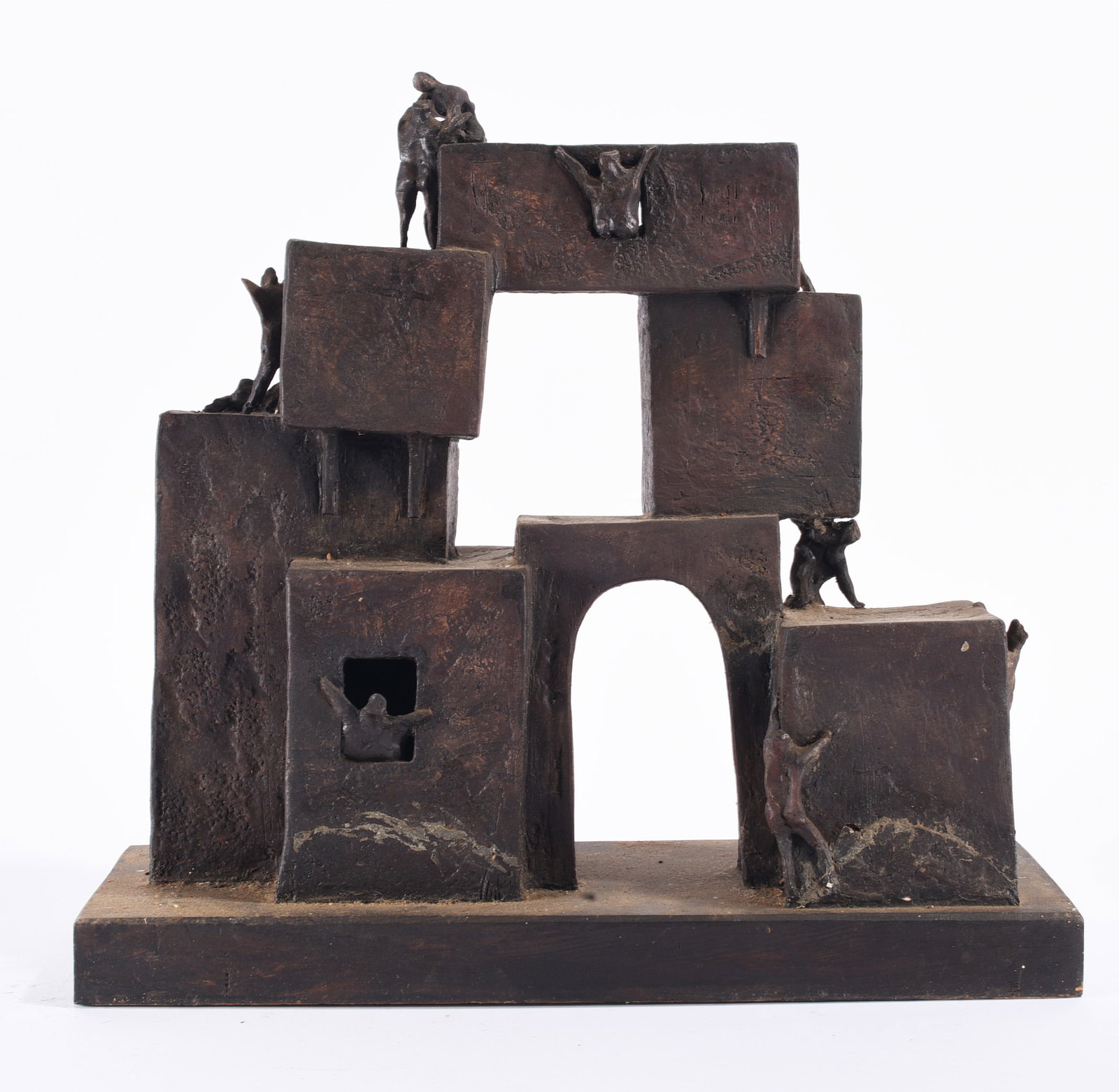 Nadine Carnow (1942-2009): Sculptural work by Nadine Carnow (1942–2009), composed of stacked architectural geometric forms populated by small modeled human figures. Finished in a dark bronze-toned surface, the work explores