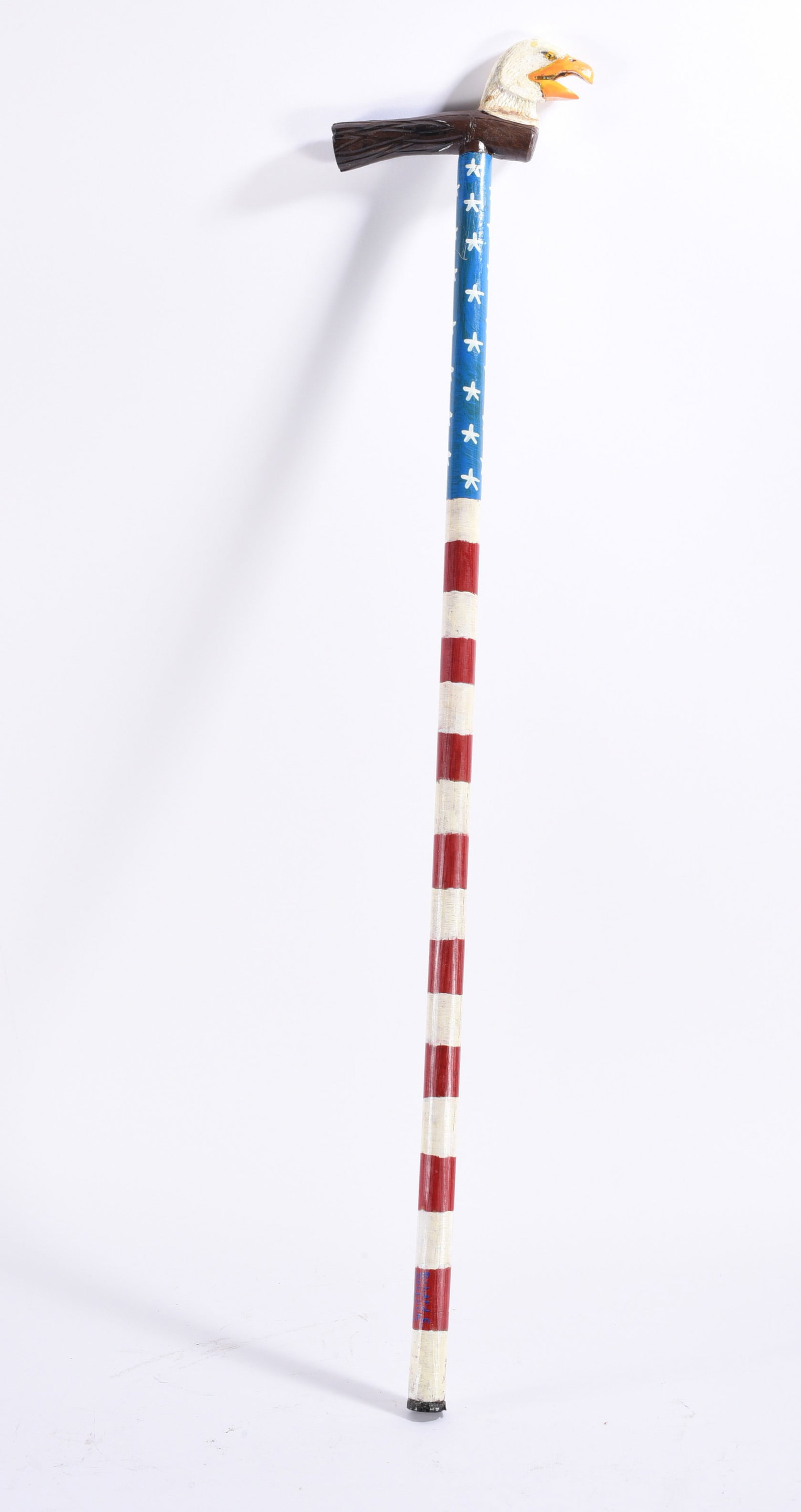 Richard Roebuck Folk Art Painted Cane Walking Stick: Hand-carved and painted patriotic folk art walking stick by Richard Roebuck, surmounted by a carved American bald eagle head with open beak. The shaft is painted in a red, white and blue American flag