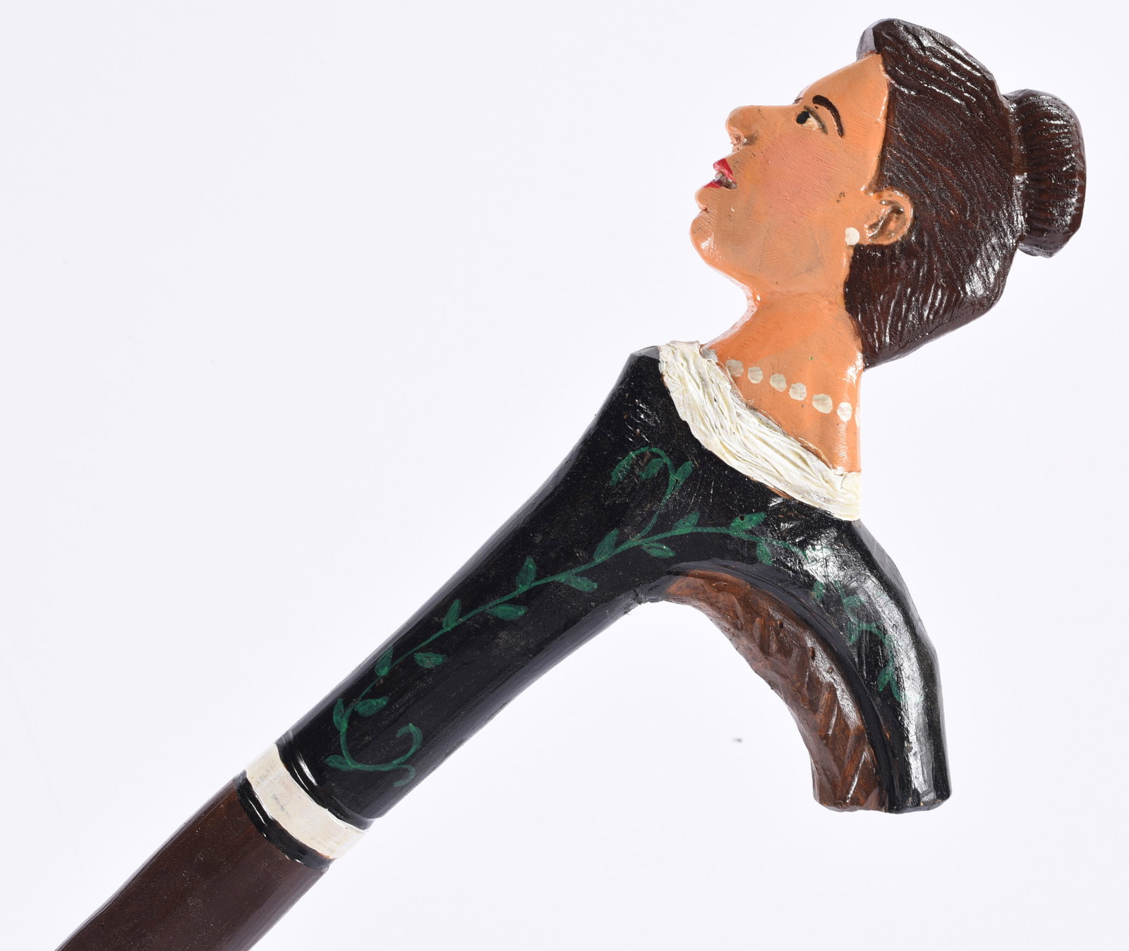 Richard Roebuck Folk Art Painted Cane Walking Stick: Hand-carved and painted folk art walking stick by Richard Roebuck, topped with the sculpted head and upper torso of a woman with dark hair arranged in a bun. She wears a black garment embellished with