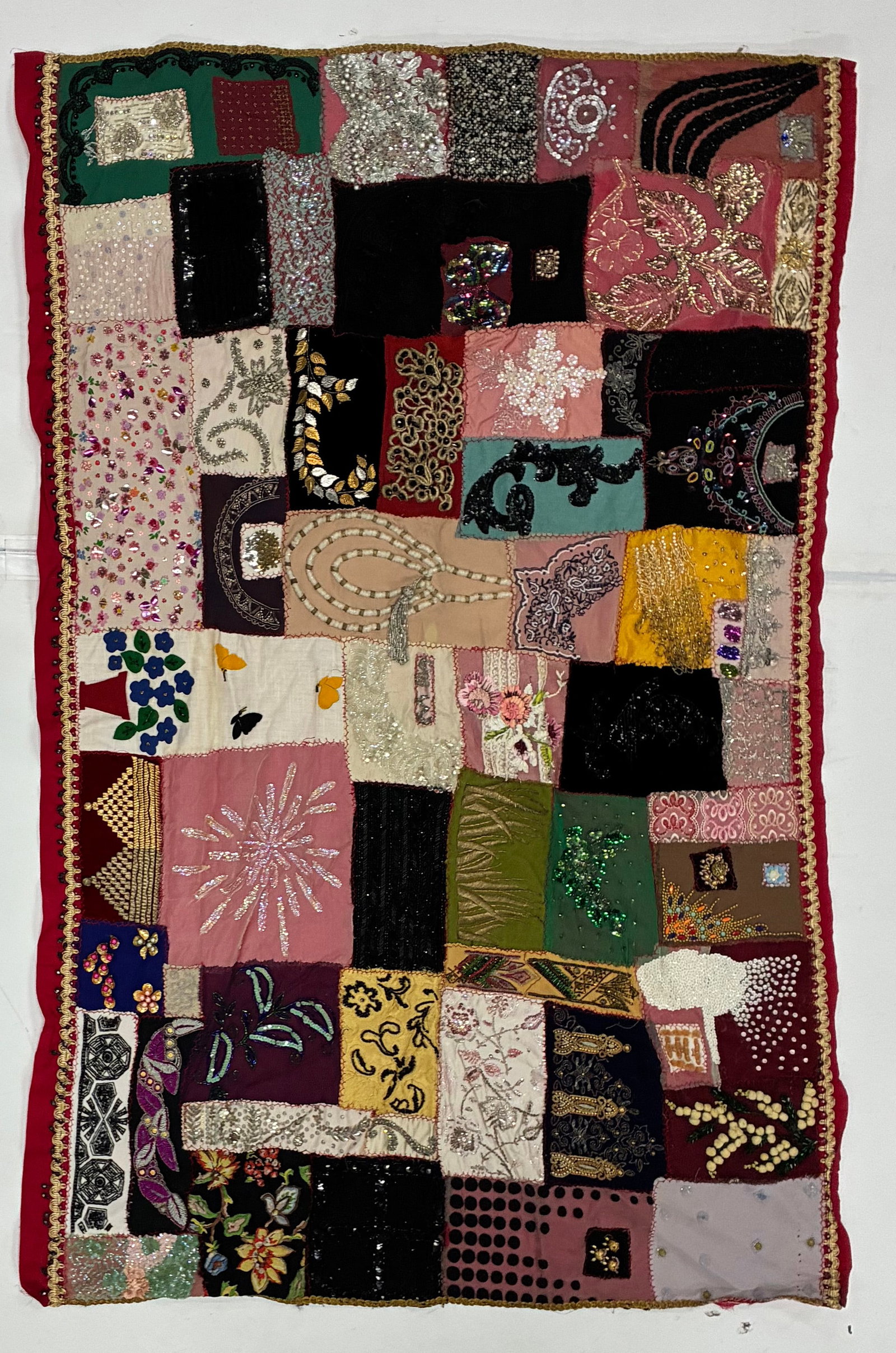 American Embellished Crazy Quilt Textile with Beadwork & Sequins: 57"x39" Elaborately embellished American Crazy Quilt-style textile assembled from rectangular and irregular fabric pieces in pink, burgundy, black, green, cream, gold and other colors. Individual patc