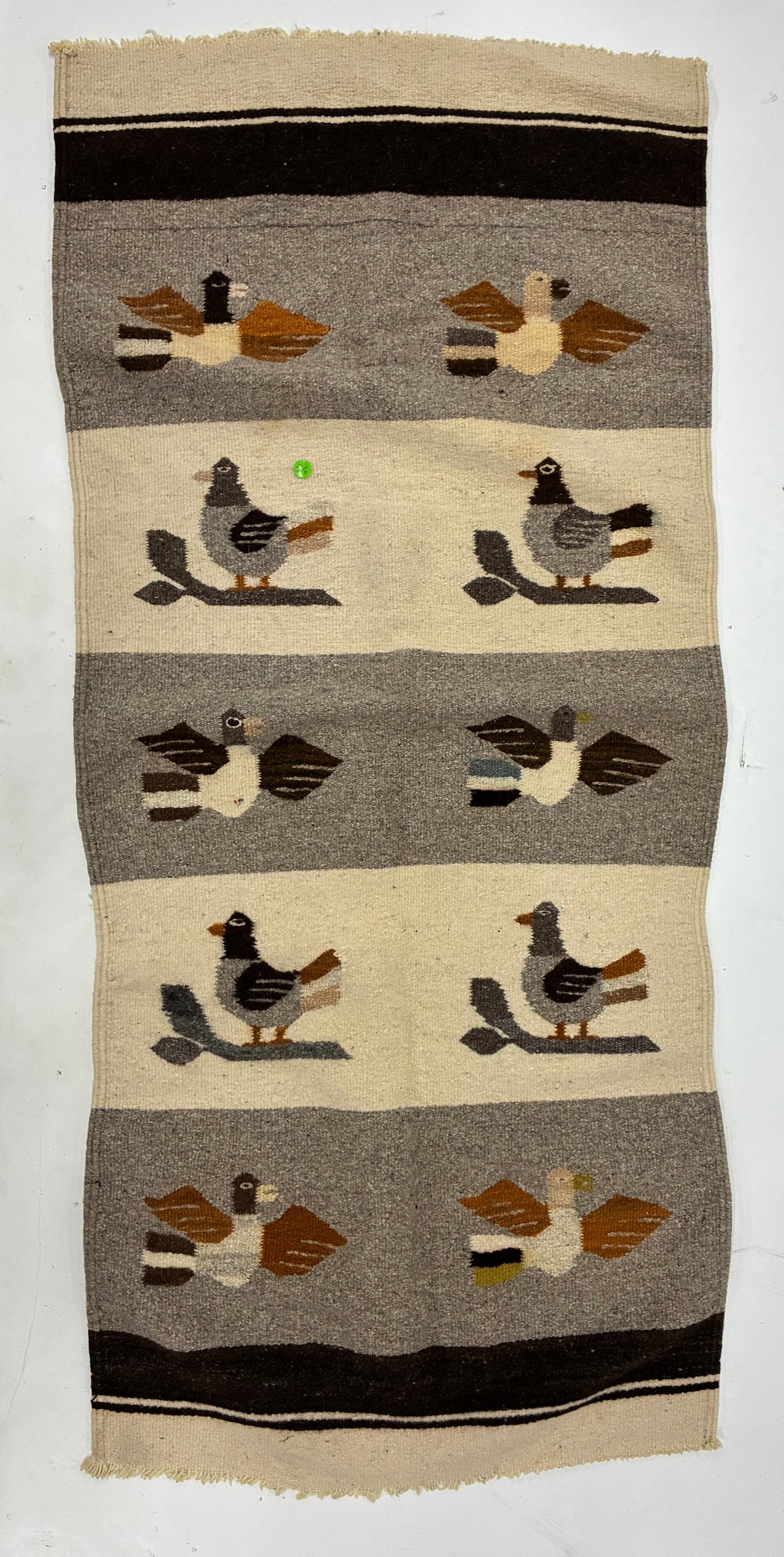 Vintage Handwoven Pictorial Bird Textile: 56"x24" Handwoven pictorial textile featuring repeated stylized birds arranged in horizontal bands of gray, cream and brown. Some birds are shown in flight while others perch upon simplified