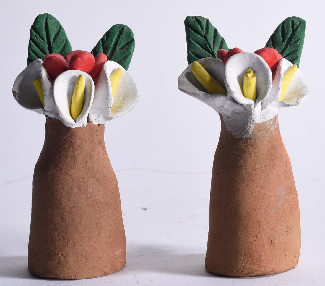 Southwest Indian Pottery Folk Art: Both 5" Pair of hand-built Southwestern Native American-style pottery flower sculptures, each formed as a tapered earthenware vessel supporting modeled white calla lily-type blossoms, red berries and 