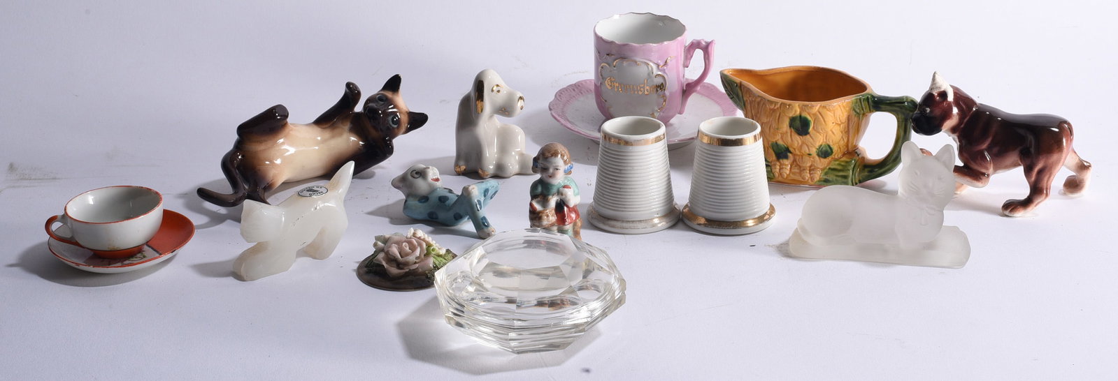 Vintage Porcelain Glass & Ceramic Miniature Collection: Ships in a 12"x12"x12" Collection of vintage smalls including porcelain and ceramic animal figures, miniature cup and saucer, souvenir cup, corn-form pitcher, thimble-form pieces, floral ornament, gla