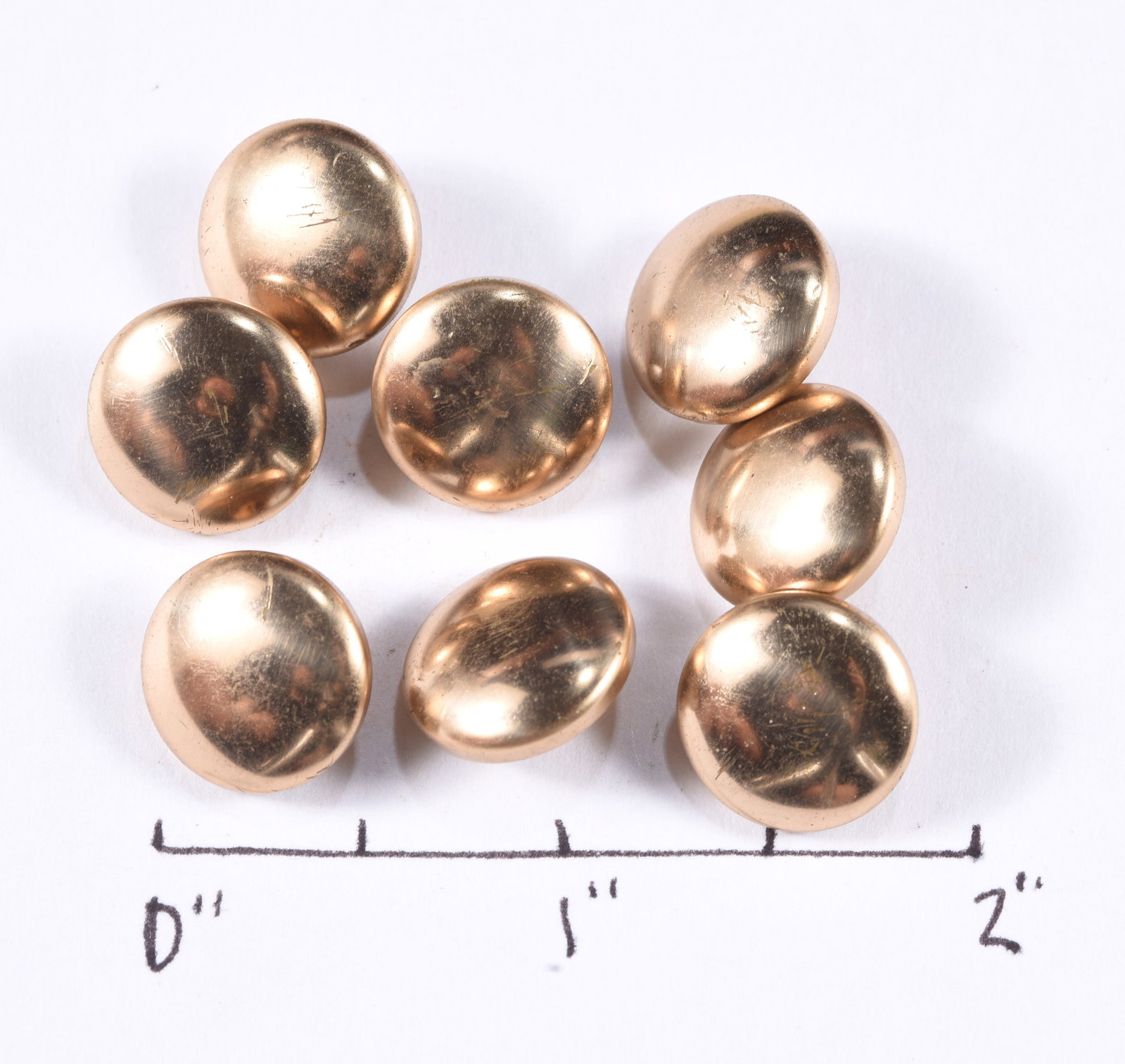 Set of Eight Plain Domed Brass Clothing Buttons: see photos for details.