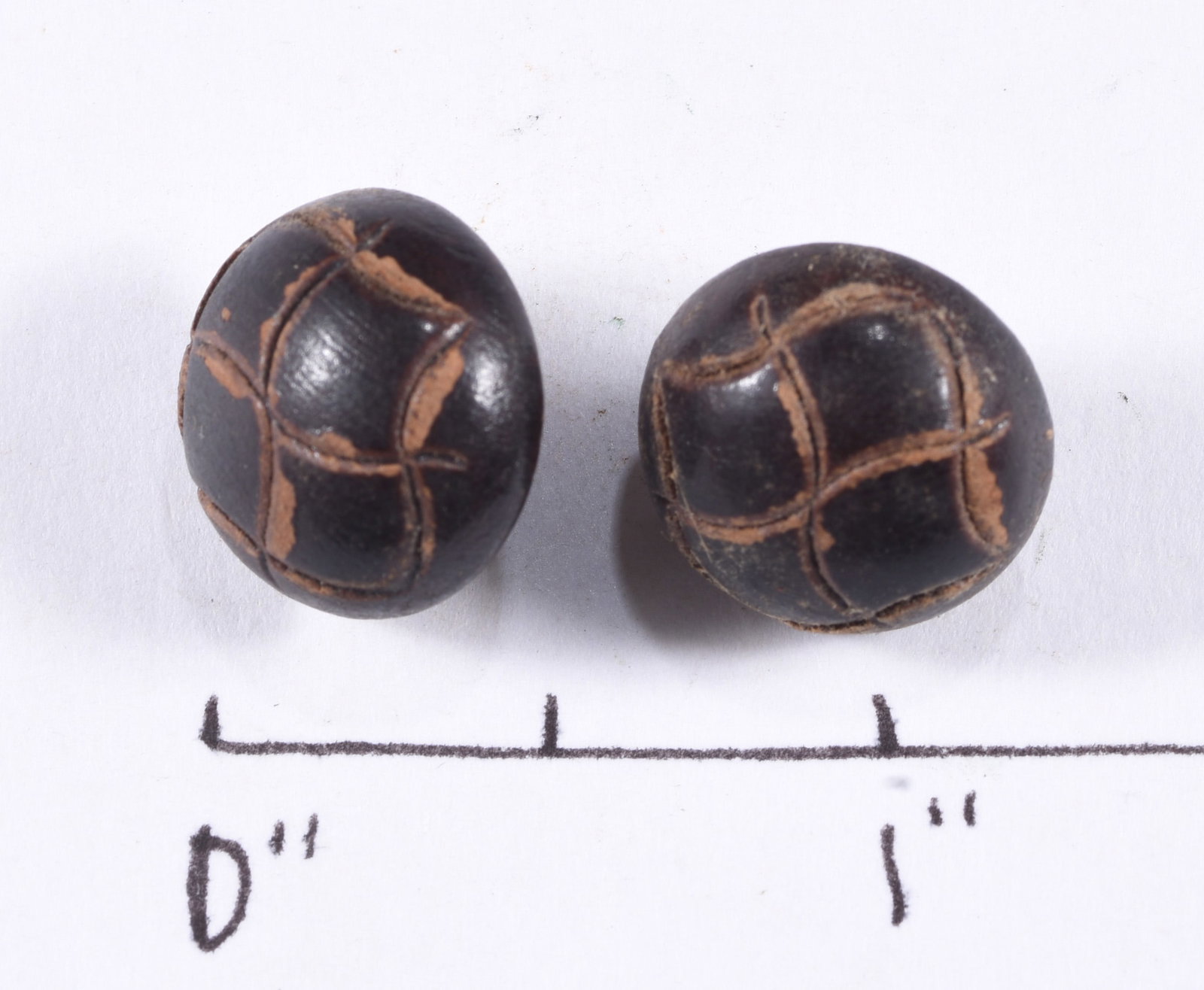 Pair of Carved Leather Covered Buttons: see photos for details.