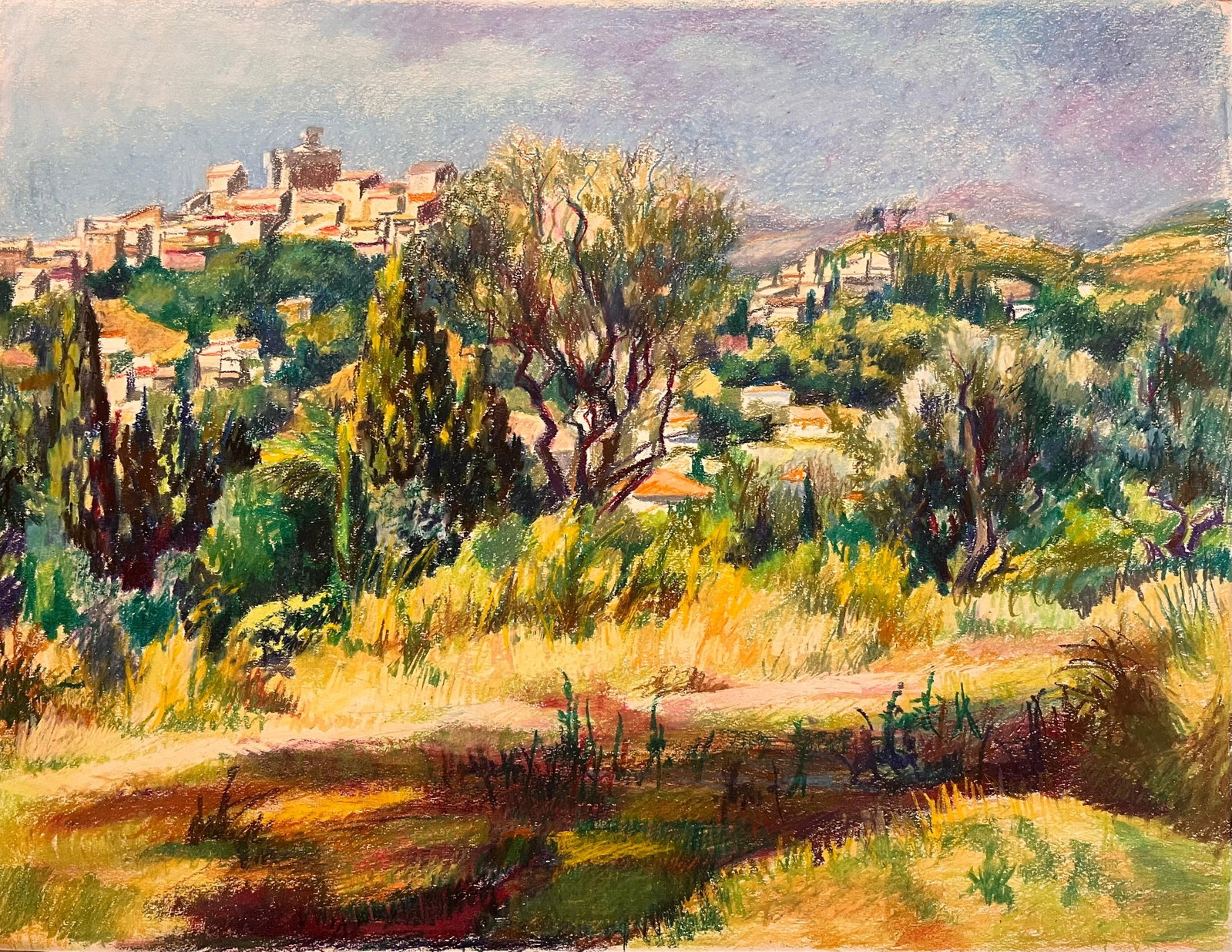 Josine Vignon Hilltop Village Provence Oil Pastel Landscape: Original mid-century oil pastel on artist paper by Josine Vignon, stamped verso. The work shows a hilltop Provençal village seen across olive trees, cypresses and sunlit fields, with Vignon's vivid p