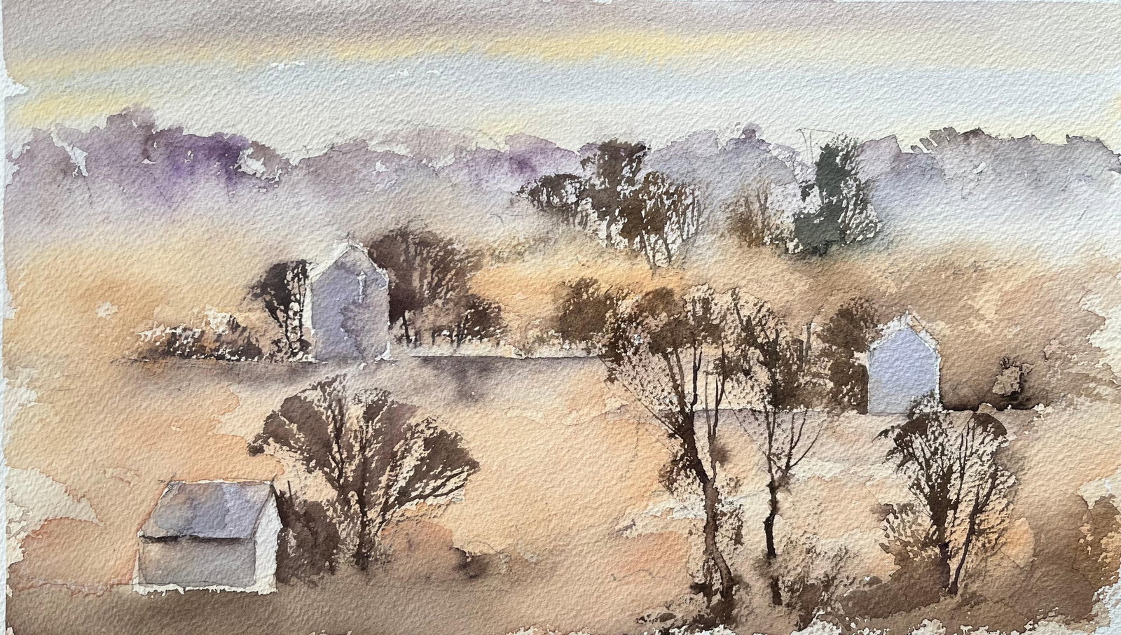 British Watercolor Misty Morning Landscape Houses: Original watercolor on artists paper by Anthony Avery depicting a misty morning landscape with distant houses. The composition uses soft light and muted colour to create a peaceful atmospheric scene i