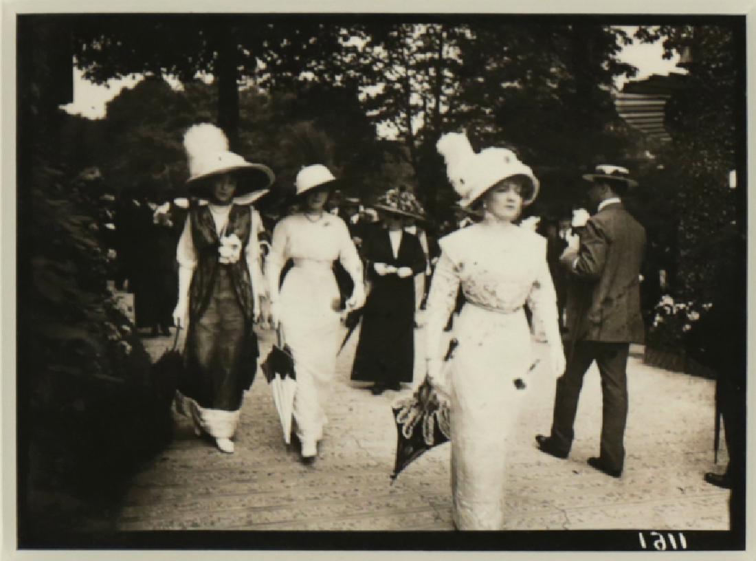 JACQUES HENRI LARTIQUE FRENCH 1894-1986: Elegant Ladies on the Boulevard, gelatin silver print, 3 3/4 x 4 7/8 in (4.5 x 12.3 cm), pencil signed verso