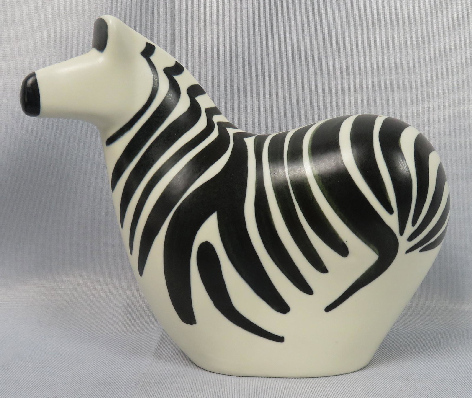 Mid-Century Modern Arabia Finland Pottery Zebra Figure: Maker: Arabia Designer: Lillemore Mannerheim for World Wildlife Foundation Location of Manufacture: Finland Period of Manufacture: 1980's Material: Pottery Dimensions: 9"(l) x 7"(h) x 4"(w) Weight: 1 