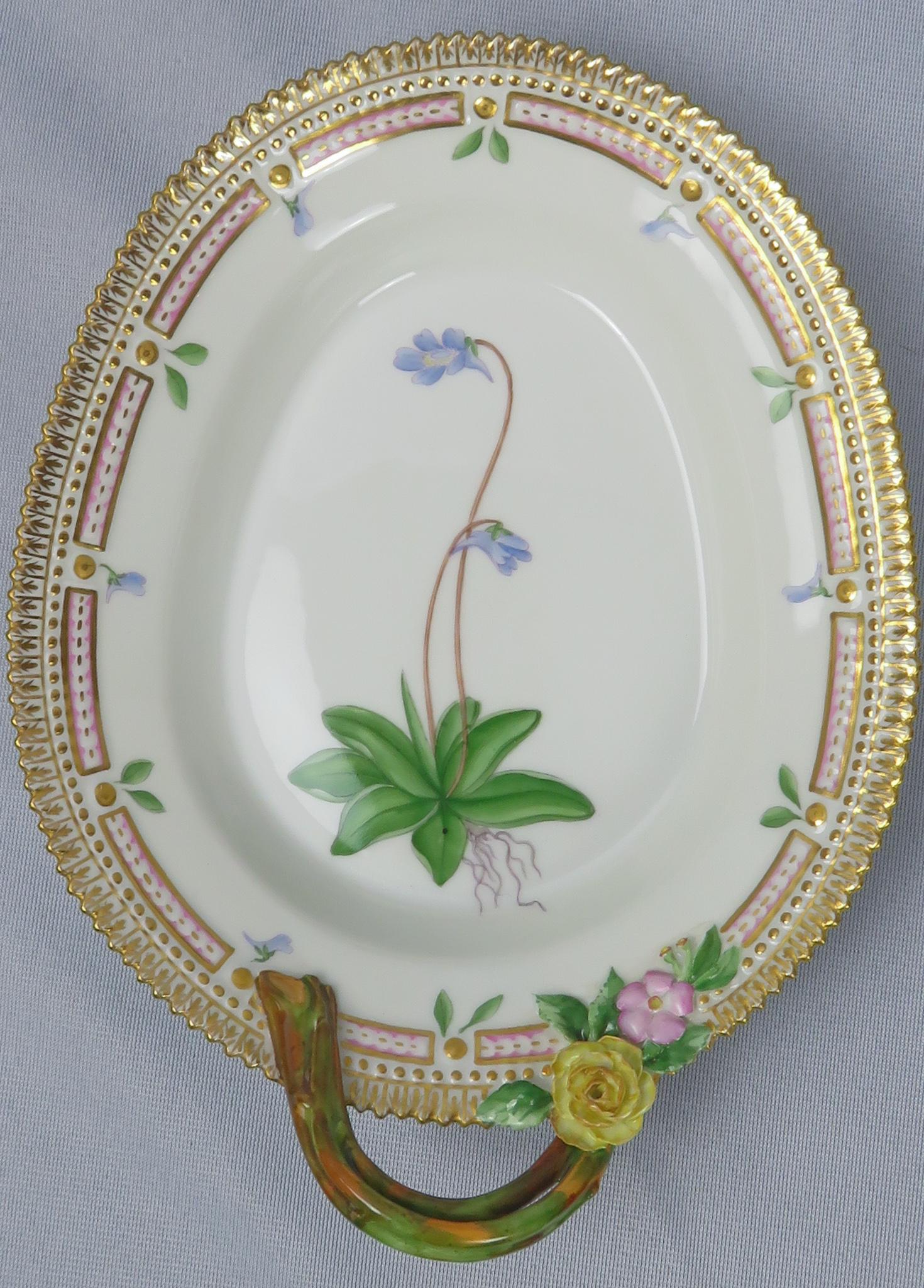 Royal Copenhagen Flora Danica Porcelain Relish Dish: Manufacturer: Royal Copenhagen Location of Manufacture: Denmark Pattern: Flora Danica Depiction: Pinguicula vulgaris (Butterwort/Bladderwort) Material: Gilt Porcelain Date of Manufacture: 1964 Dimensi