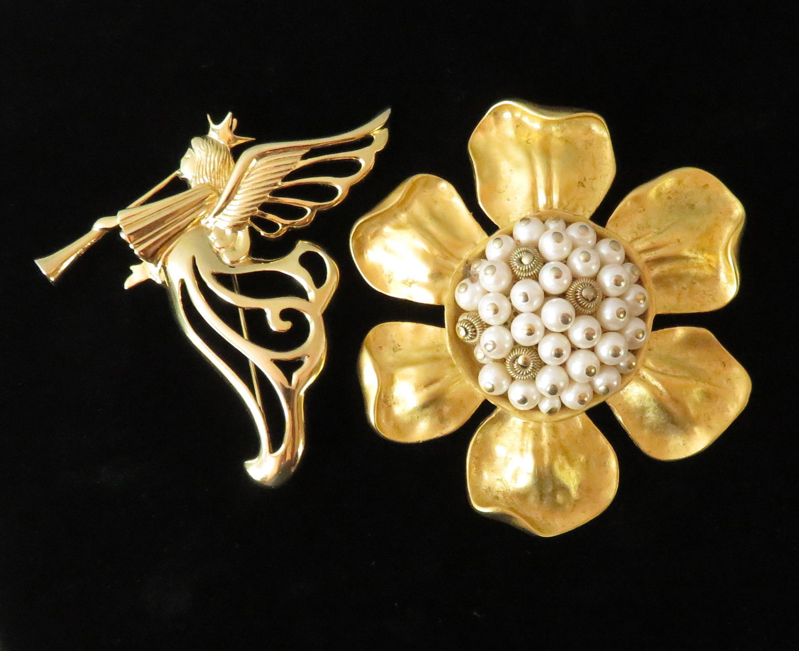 Vintage Pair Oversized Gold Givenchy France Brooches: Maker: Givenchy Period of Manufacture: 1980's Location of Manufacture: France Dimensions of Floral Brooch: 3" diameter Dimensions of Angel Brooch: 2 7/8"(l) x 3"(w) Weight of Brooches (both): 3 ounces