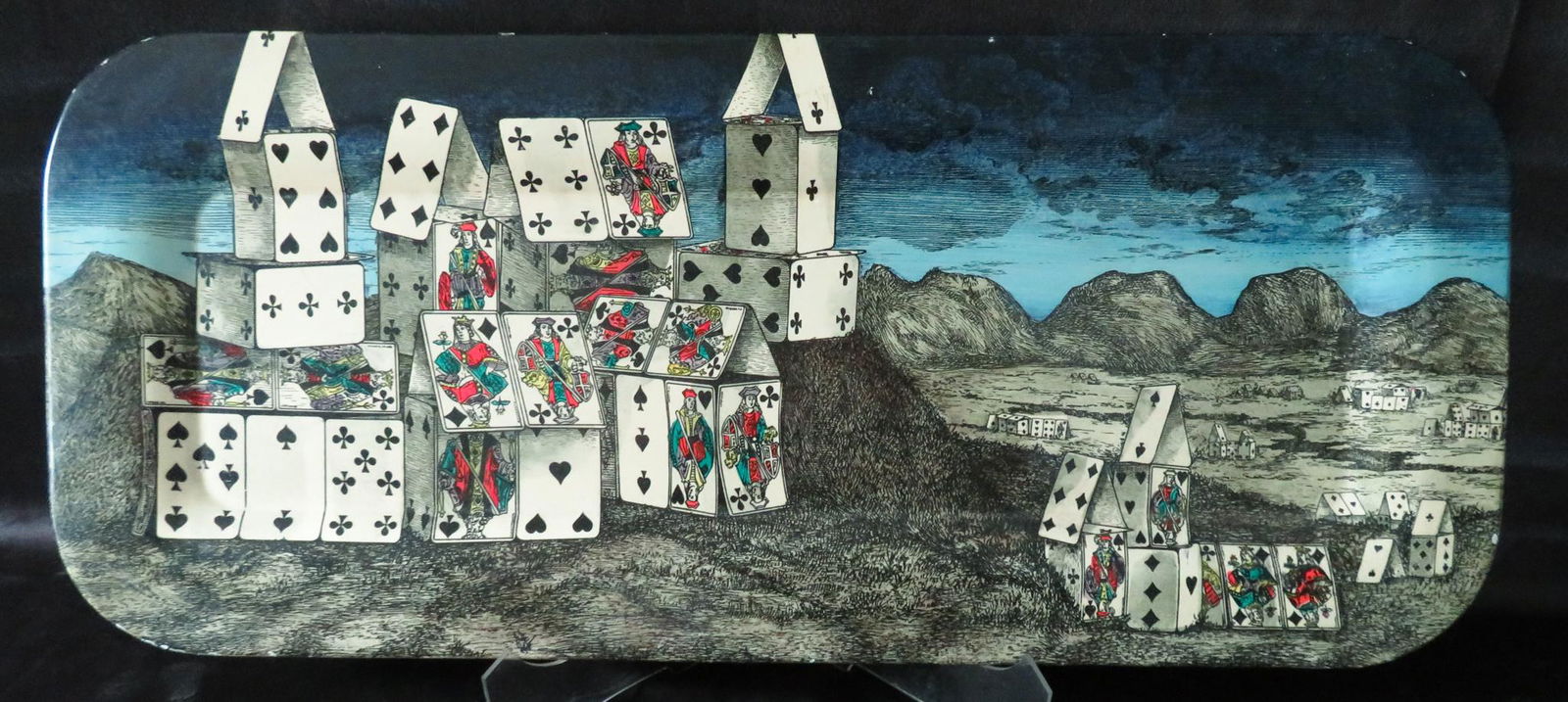 23" Piero Fornasetti "Citte di Carte" Metal Tray c.1955: Manufacturer: Piero Fornasetti Location of Manufacture: Milan, Italy Title: Citta di Carte / City of Cards Period of Manufacture: circa 1955 Dimensions: 23"(l) x 10"(h) Weight: 1 lbs. 7 oz. For your c