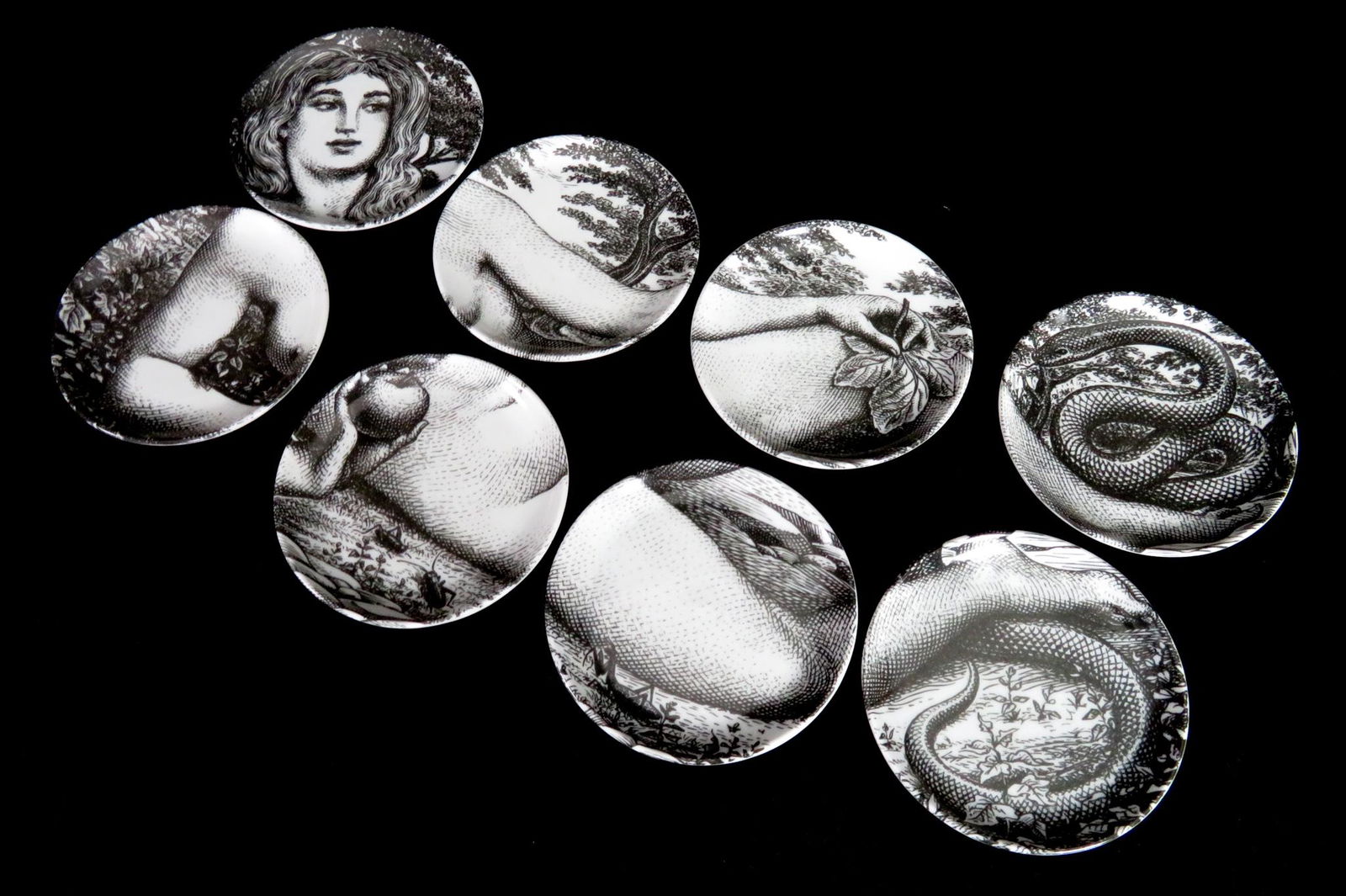 Piero Fornasetti 'Eva' Small Plates in Original Box: Manufacturer: Piero Fornasetti Location of Manufacture: Milan, Italy Period of Manufacture: circa !960's Dimensions of Each Plate: 3 13/16" diameter Dimensions of Box: 4 3/8" diameter ; 2 5/8"(h) Weig
