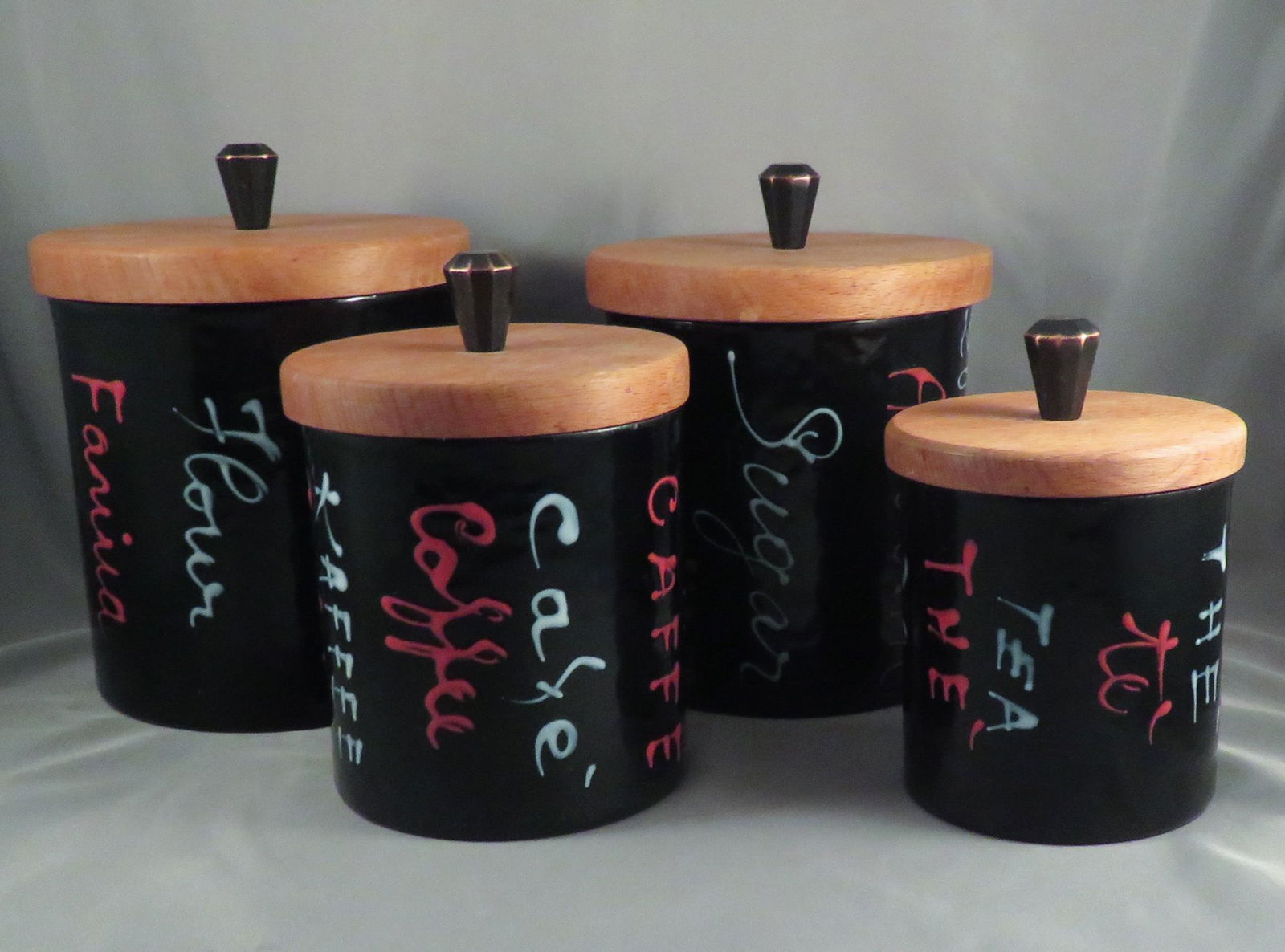 Vallenti Italian Enamel Kitchen Nesting Canister Set: Manufacturer: Vallenti Location of Manufacture: Italy Period of Manufacture: 1960's Dimensions of Largest Canister: 6 5/8"(h) ; 5 1/4" diameter Dimensions of Smallest Canister: 4 7/8"(h) ; 3 1/2" diam