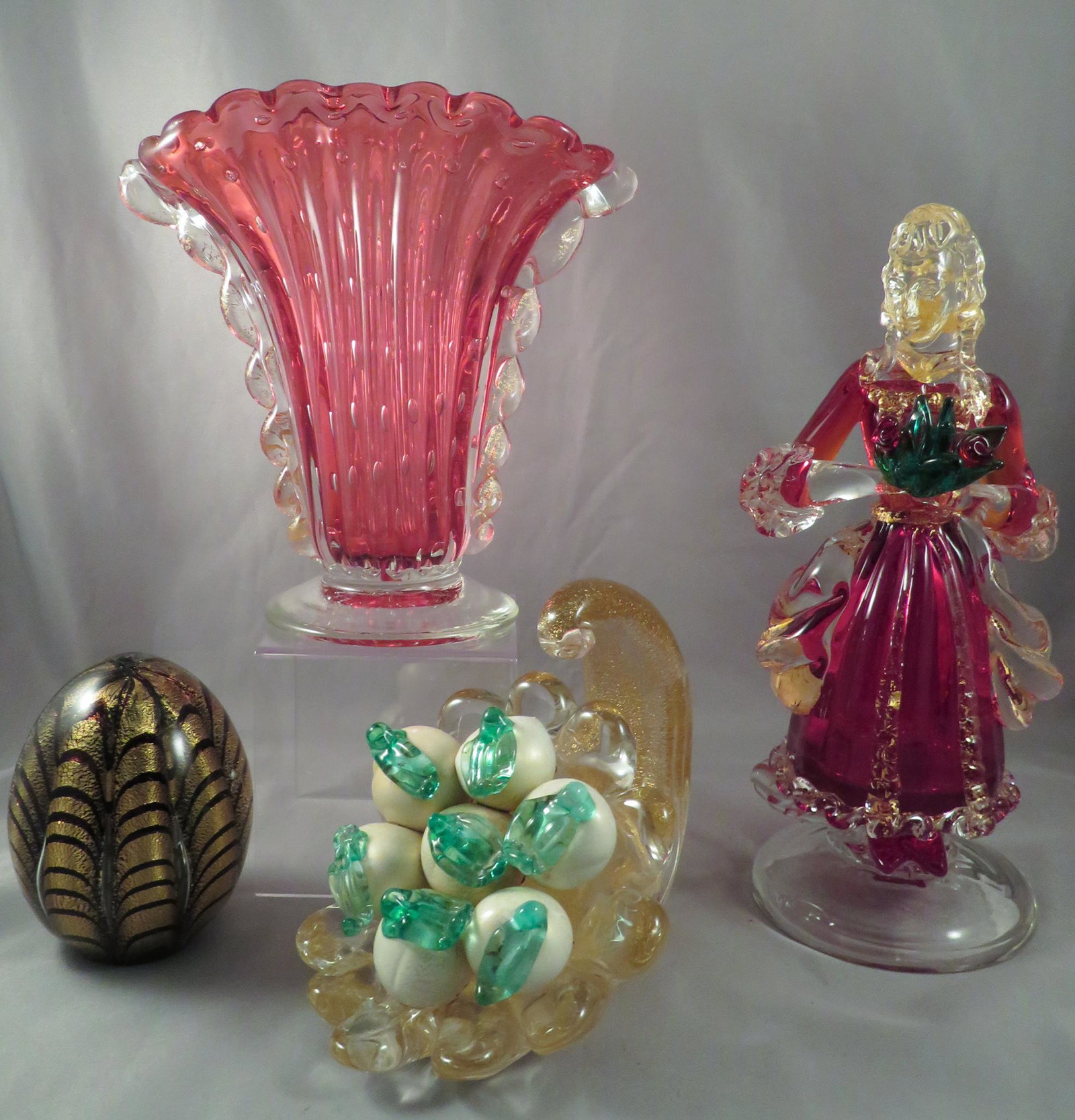 Barovier & Toso Murano Glass Figures Vase & Paperweight: Manufacturer: Ercole Barovier (Barovier & Toso)Location of Manufacture: Murano, Italy Period of Manufacture: mid-20th Century Dimensions of Lady with Flowers: 8"(h) Dimensions of Black/Gold Paperweigh