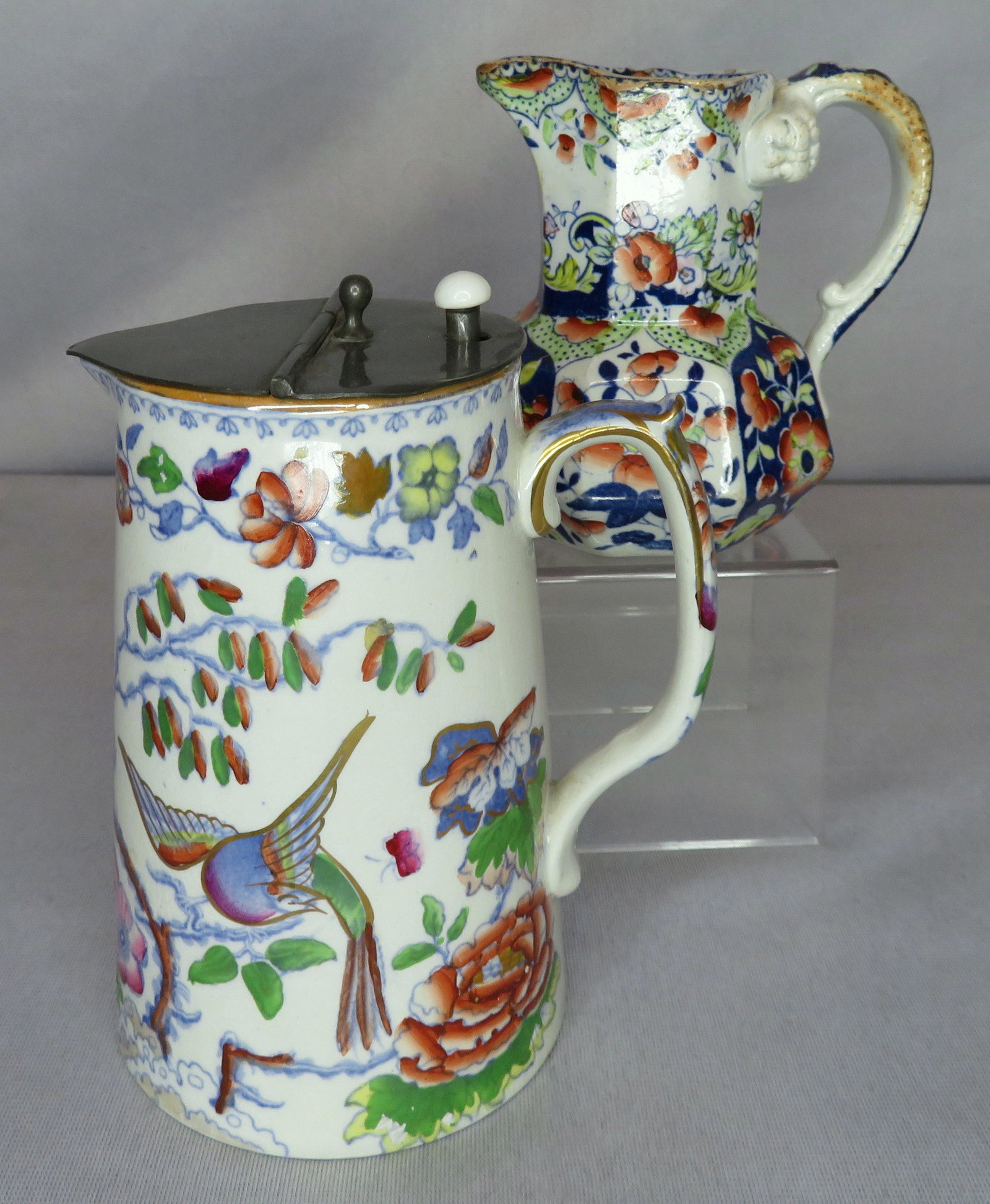 (2) Antique Masons M&N Opaque Ironstone Lidded Pitchers: Manufacturers: Mason's / Mayer & Newbold Location of Manufacture: Staffordshire, England Period of Manufacture: 19th Century Mason's Pitcher Dimensions: 6" (h) ; 5" from handle to spout M&N Pitcher Di