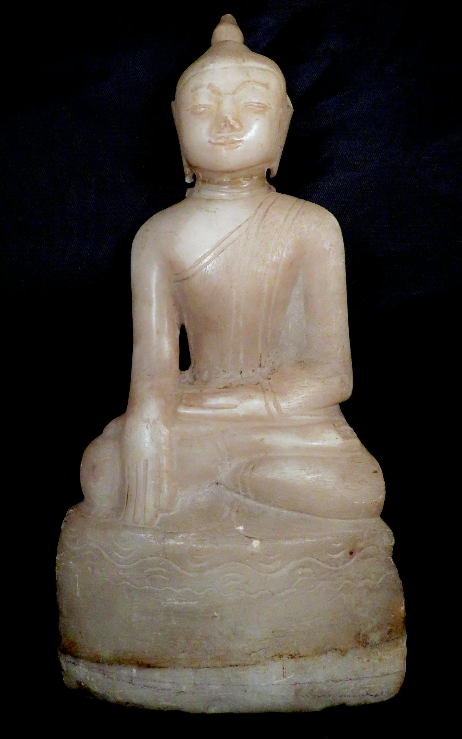 Antique Burma Carved Stone Buddha in Ava Style: Location of Manufacture: Burma (Myanmar) Period of Manufacture: 17th Century Material: Marble/Alabaster Depiction: Buddha in Bhumisparsha mudra Dimensions: 13"(h) x 6 1/4"(w) x 2 1/4"(d)Weight: 7 lbs.