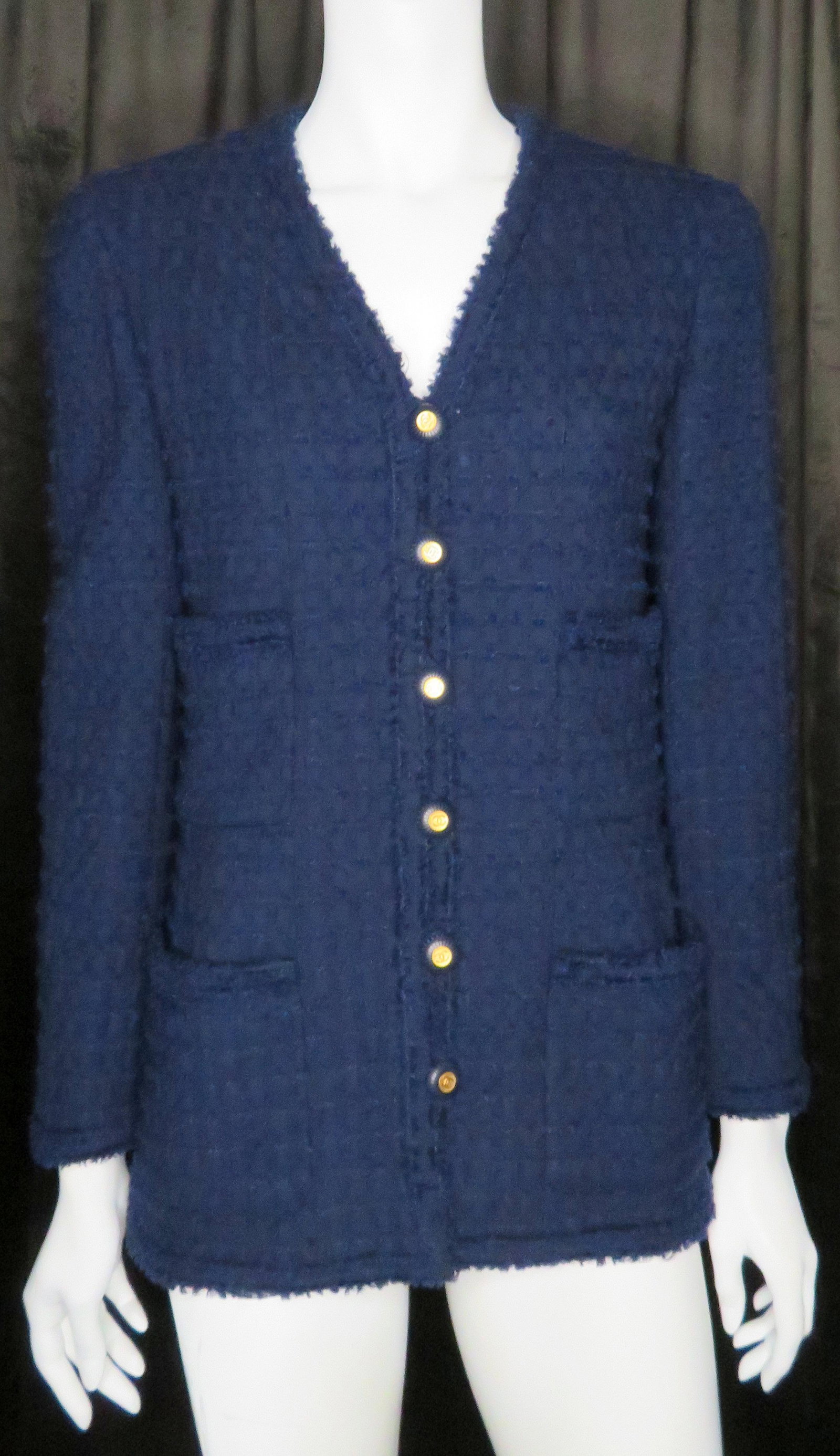 Classic Navy Chanel Four Pocket Tweed Jacket: Design House: Chanel Creative Director for Chanel: Karl Lagerfeld Location of Manufacture: Paris, France Jacket: 6-Button Front with (4) Pockets Color: Navy Fabric: Lesage Tweed Season: 1993 Size: 38 