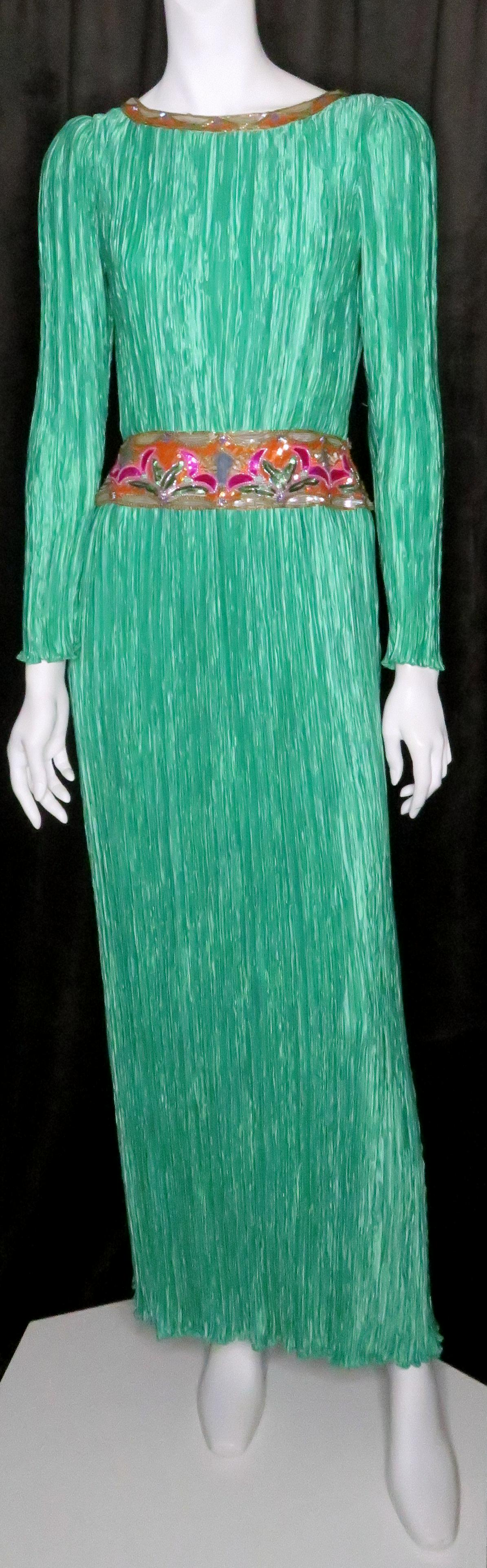 Mary McFadden Couture Fortuny Pleated Sequin Gown: Designer: Mary McFadden Couture Retailer: Neiman-Marcus Period of Manufacture: 1980's Location of Manufacture: United States Size: 4 Length: 57" Shoulder: 16" measured flat seam to seam Bust: 17" meas