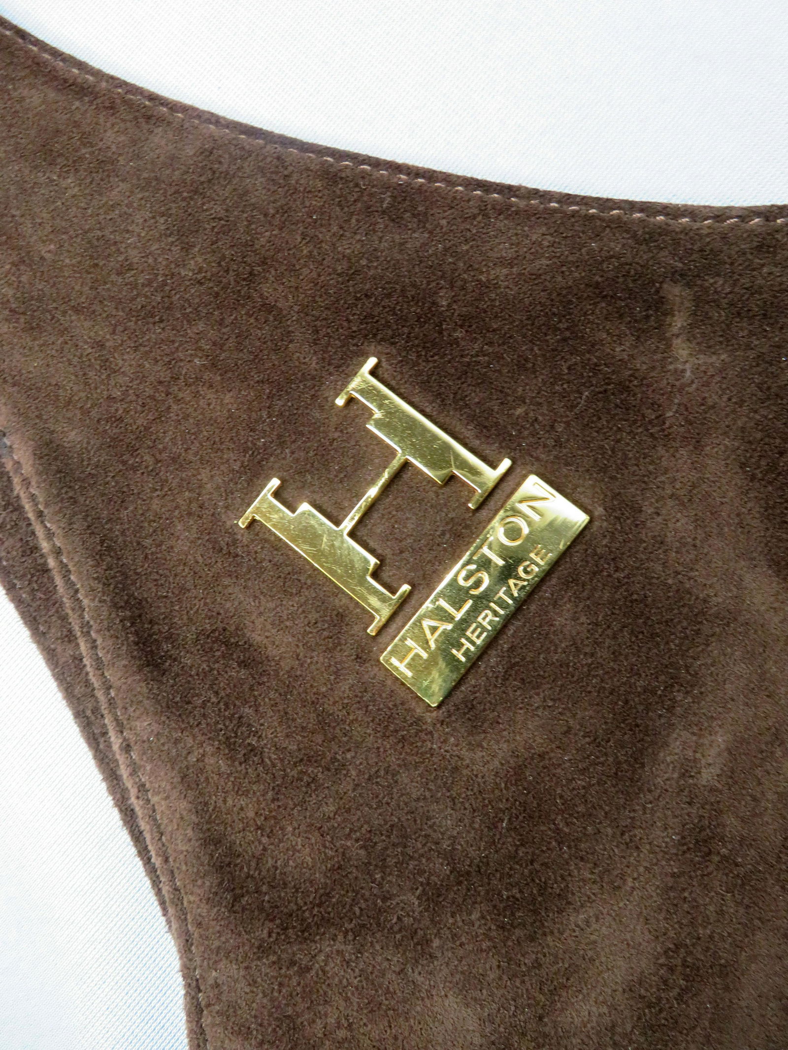 Vintage Halston Heritage Brown Suede Shoulder Bag: Designer: Halston Design Line: Heritage Drop Length: 31\" Strap Length: 16\" Width: 15 1/2\" Depth at Mouth: 14 1/2\" (tapers gently toward bottom) Weight: 1 lbs. 2 oz. For your consideration is a fan