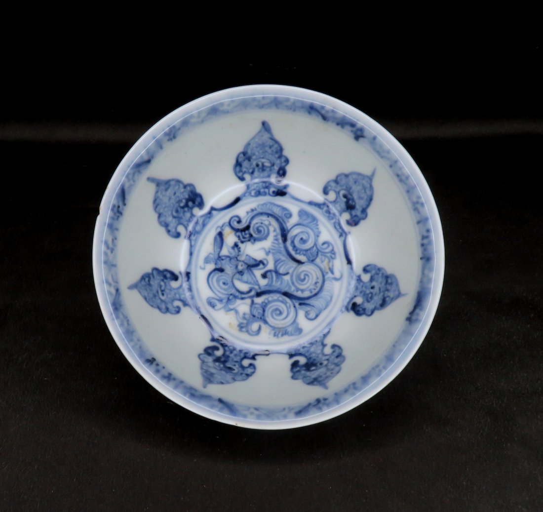 15th Century Chinese Ming Dynasty Porcelain Dragon Bowl: Location of Manufacture: China Period of Manufacture: Ming Dynasty (1368-1644) ; 15th Century Dimensions of Bowl: 6 1/8" diameter at rim ; 2 5/8" in height ; 2 1/2" diameter at foot ; 1/4" foot height