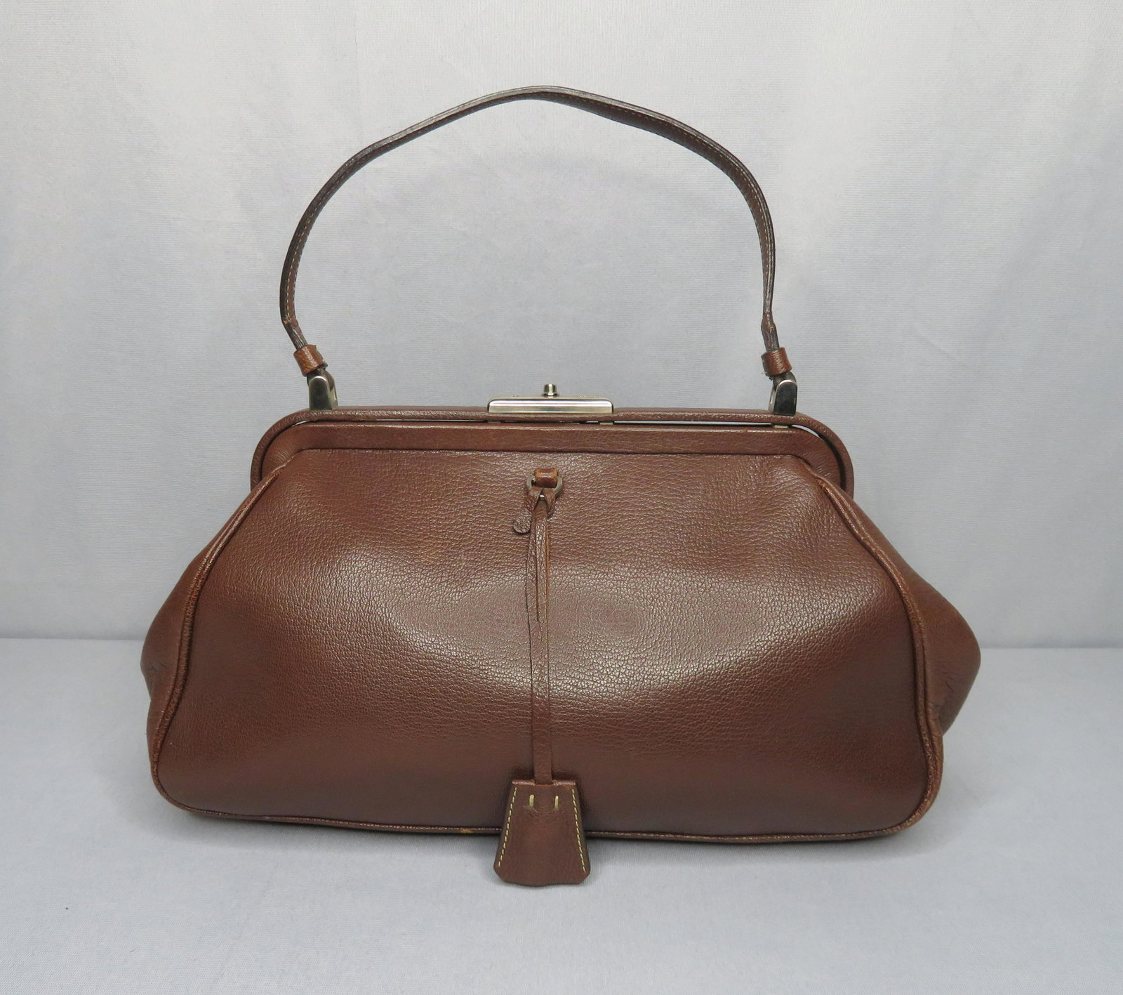 Authentic Prada Madras Cerniera Cacao Doctors Bag Purse: Designer: Prada Location of Manufacture: Italy Material: Leather Hardware: Silver Handle Drop: 6 1/2” (handle to top of bag when hanging) Height of Bag: 7 1/2" Width of Bag: 13" Depth of Bag: 4 1/2�