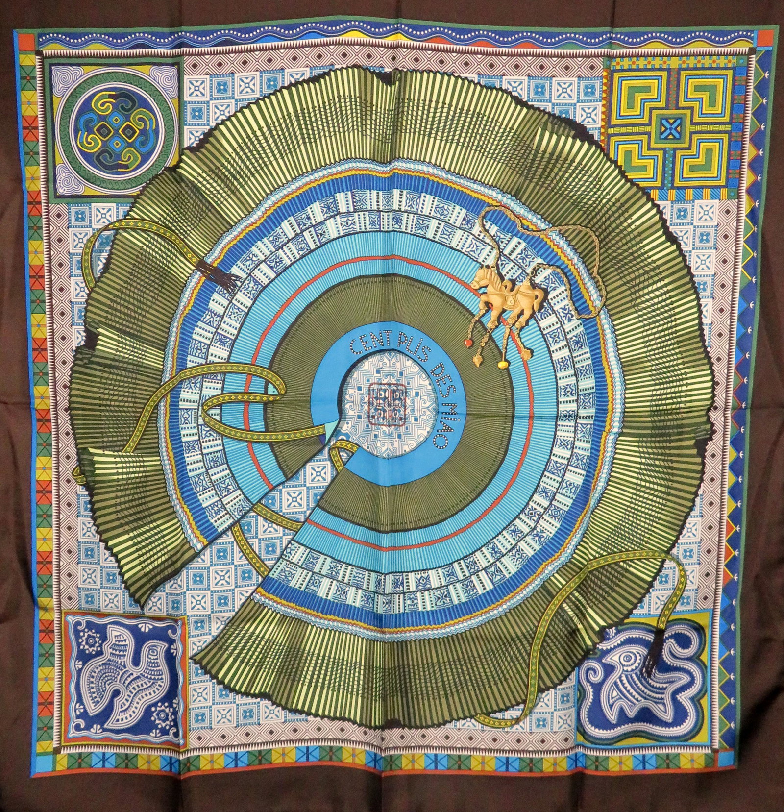 2010 Hermes CENT PLIS DE MIAO Silk Scarf Aline Honore: Manufacturer: Hermes Location of Manufacture: Paris, France Designer: Aline Honore Title of Design: Cent Plis de Miao / Hundred Folds of Miao Year of Design: 2010 Dimensions: 90cm square / 35" square 