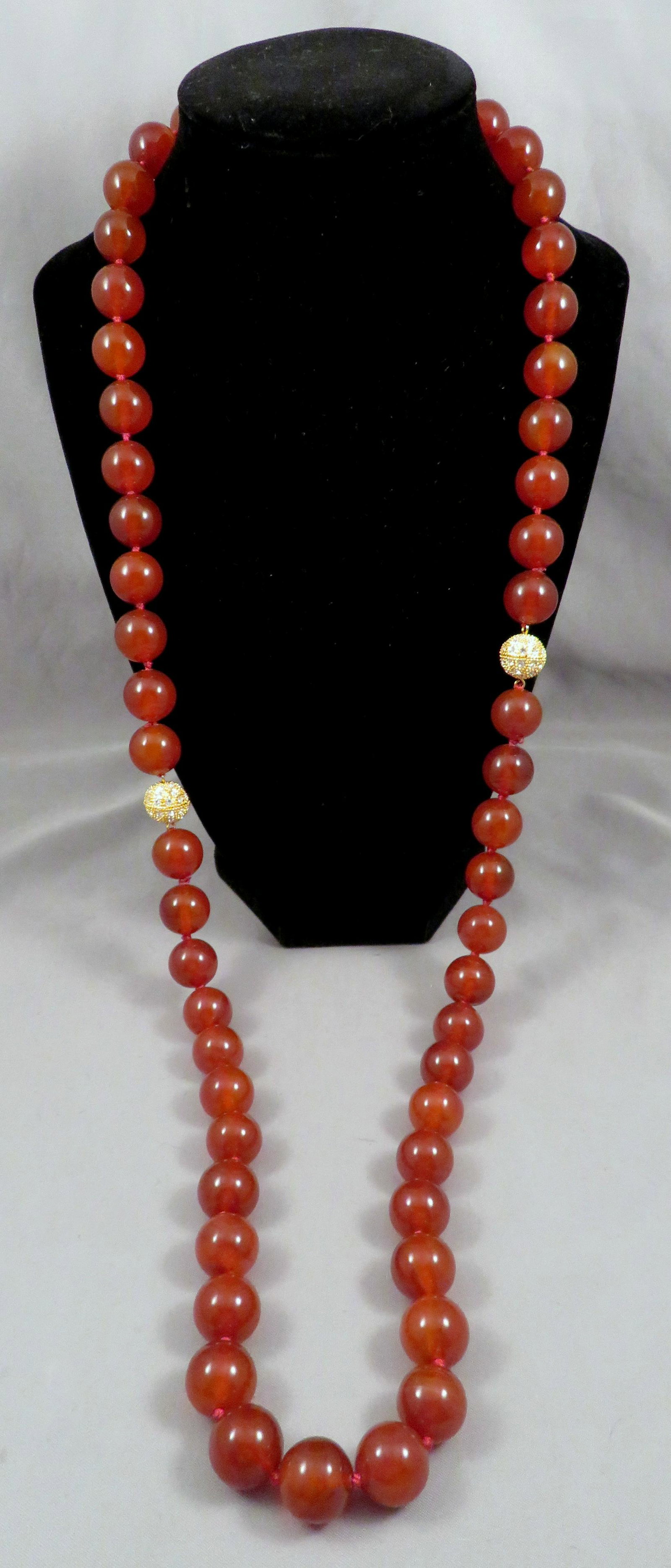 35" Red Carnelian 14mm Bead Necklace with Fancy Clasp: Material: Red Carnelian Bead Size: 14mm Length: 35" or (2) Necklaces at 17.5" each For your consideration is a gorgeous red carnelian bead necklace with fancy clasp. The beads are hand strung and knot
