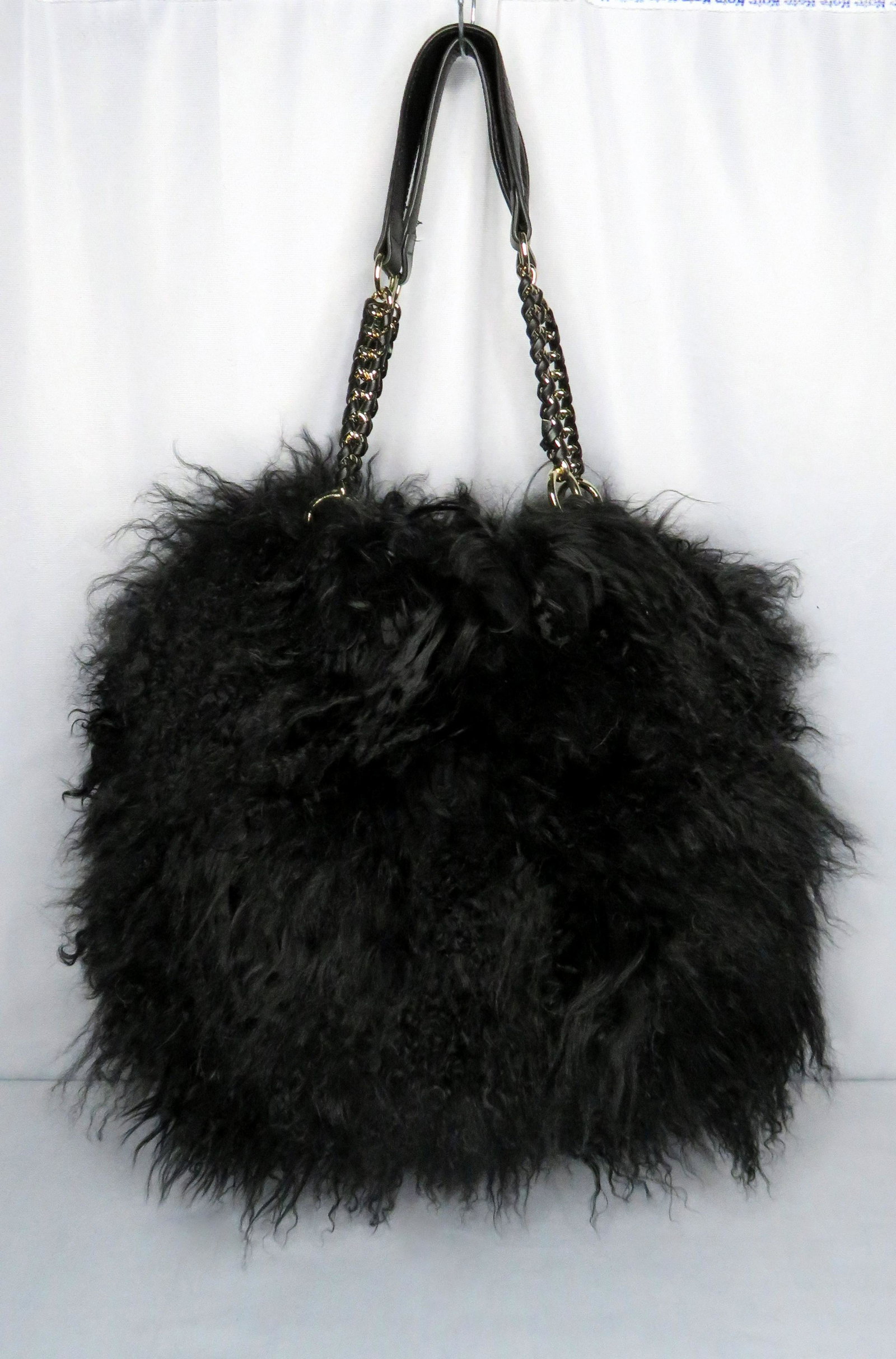 Oversized Black Tibetan Mongolian Lamb Fur Sack Purse: Handle Drop Length: 10" Interior Bag Dimensions: 11"(l) x 12"(w) Exterior Bag Dimensions (includes fur & handles): 27"(l) x 18"(w) For your consideration is a stunning authentic black Tibetan/Mongolia