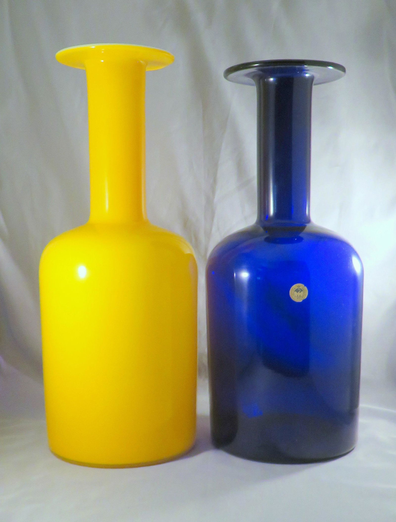 (2) Brauer Gulvvase Kastrup Holmegaard Vases w/ Label: Designer: Otto Brauer (1897-1938) Manufacturer: Kastrup Holmegaard Design Date: c.1958 Location of Manfacture: Denmark Dark Blue Vase Height: 14" / 35.5cm Dark Blue Vase Weight: 3 lbs. 1 oz. Yellow Op