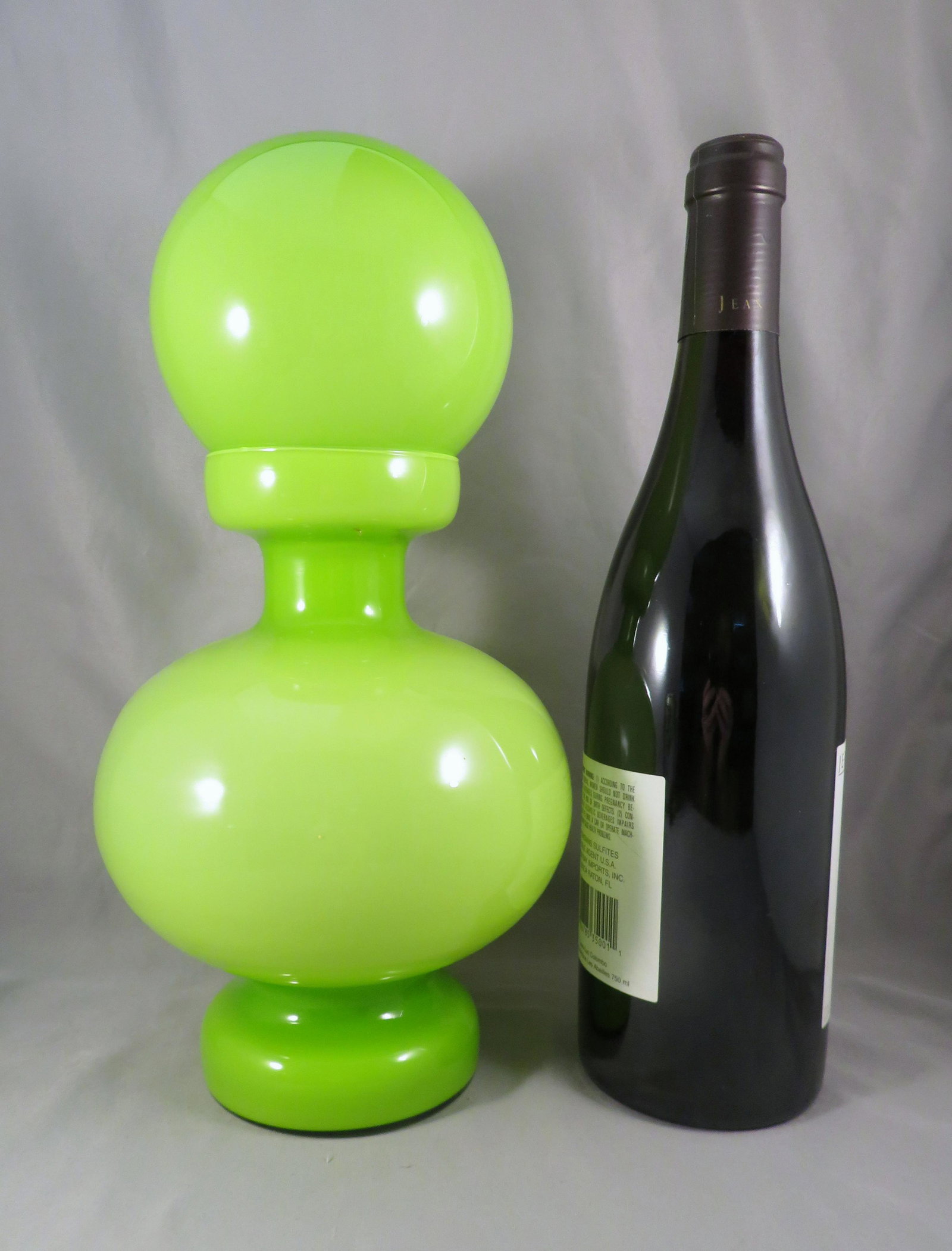 1960's Scandinavian Green & White Cased Glass Decanter: Period of Manufacture: c.1960s Dimensions: 11 1/2"(h) ; maximum diameter of 5 1/2" Weight: 1 lbs. 6 oz. For your consideration is a stunning 1960's bulbous green and white cased glass decanter. The qu
