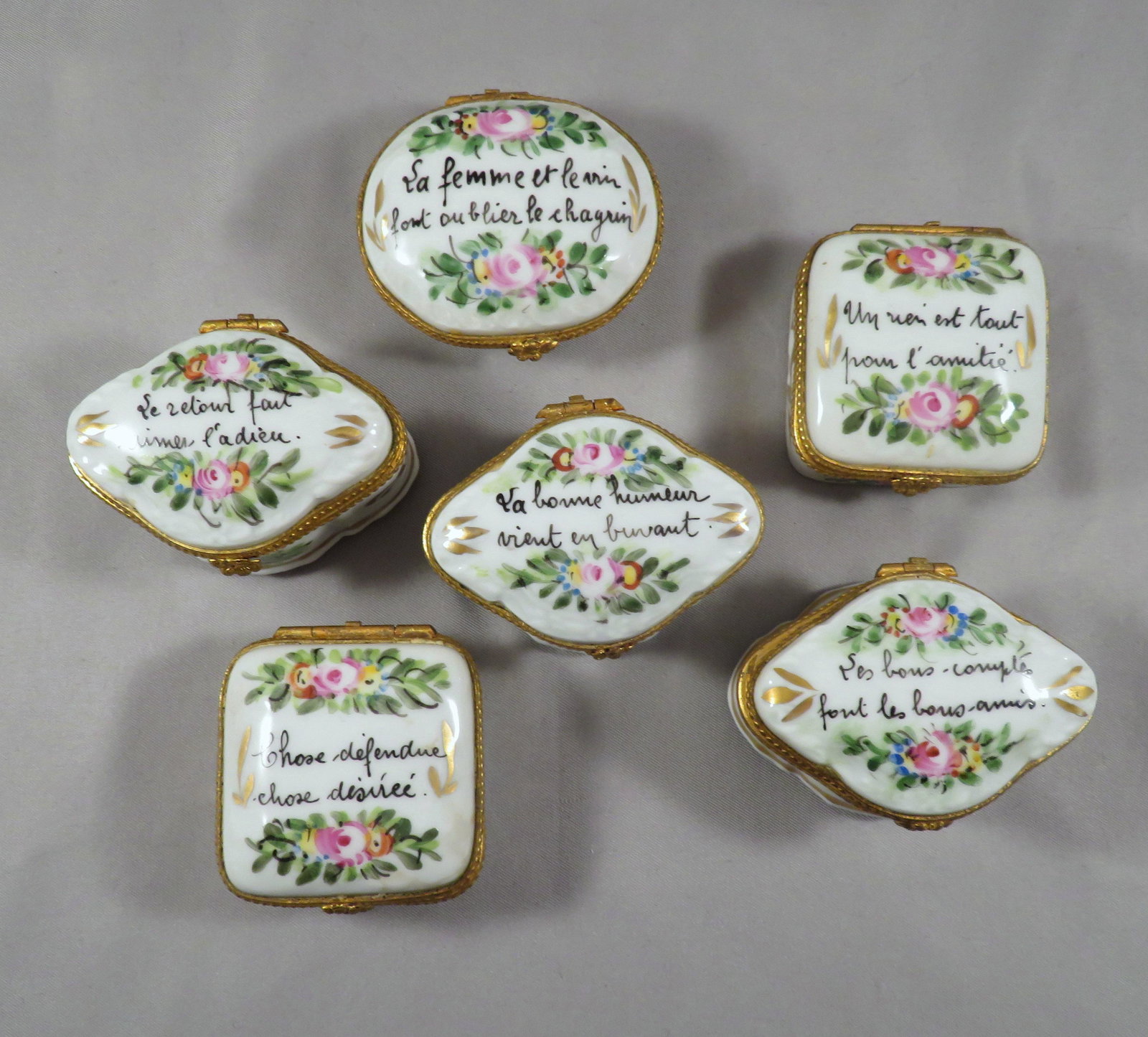 Lot of (6) French Limoges Porcelain Motto Patch Boxes: For your consideration are (6) signed Limoges French porcelain boxes embellished with floral decorations and poetic mottos. Each of the (6) boxes in this offering have different mottos, to include: - 