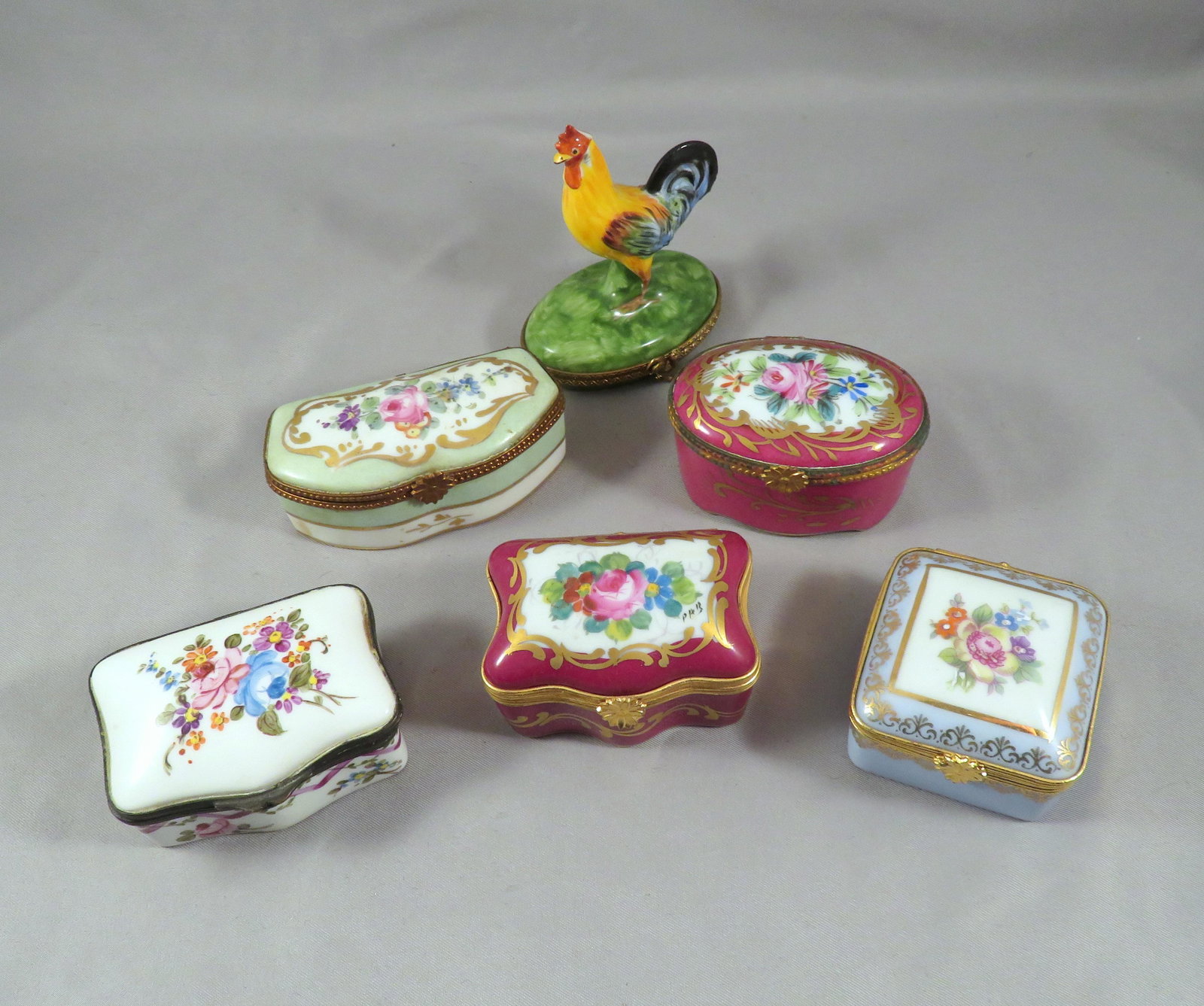 (6) French Limoges Floral Porcelain & Rooster Boxes: For your consideration are a lot of (6) Limoges french porcelain boxes from various manufacturers. One of the boxes if a beautifully composed and hand-painted rooster figural box. This box is marked o