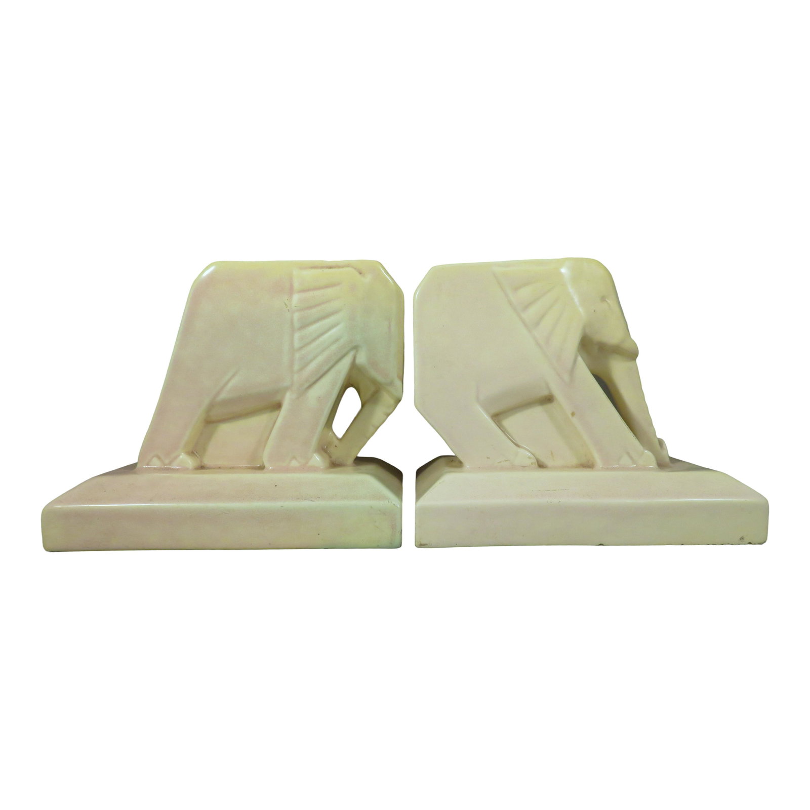 Rare Cowan Art Deco Elephant Pottery Bookends: For your consideration are a pair of signed Cowan art pottery bookends in the form of elephants. These Art Deco elephants are a matched set while one is modeled to push the books together with his hea