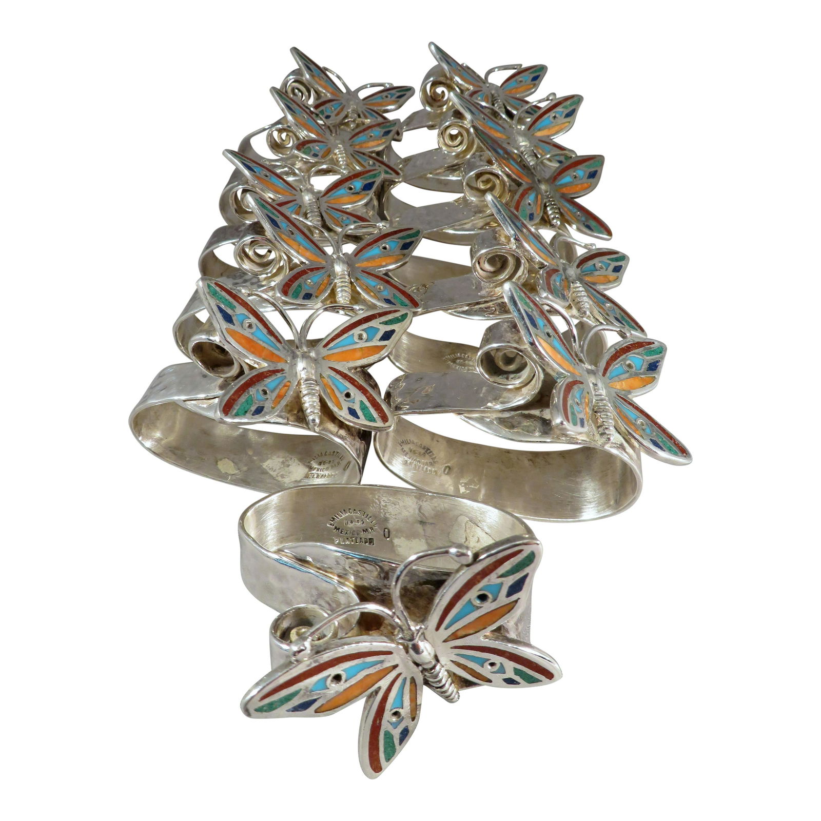 11 Emilia Castillo Inlaid Silver Butterfly Napkin Rings: For your consideration are (11) Emilia Castillo inlaid silver butterfly napkin rings. These napkin rings are hand-wrought and inlaid by Castillo's artisans with gorgeous lapidary specimens. The way th