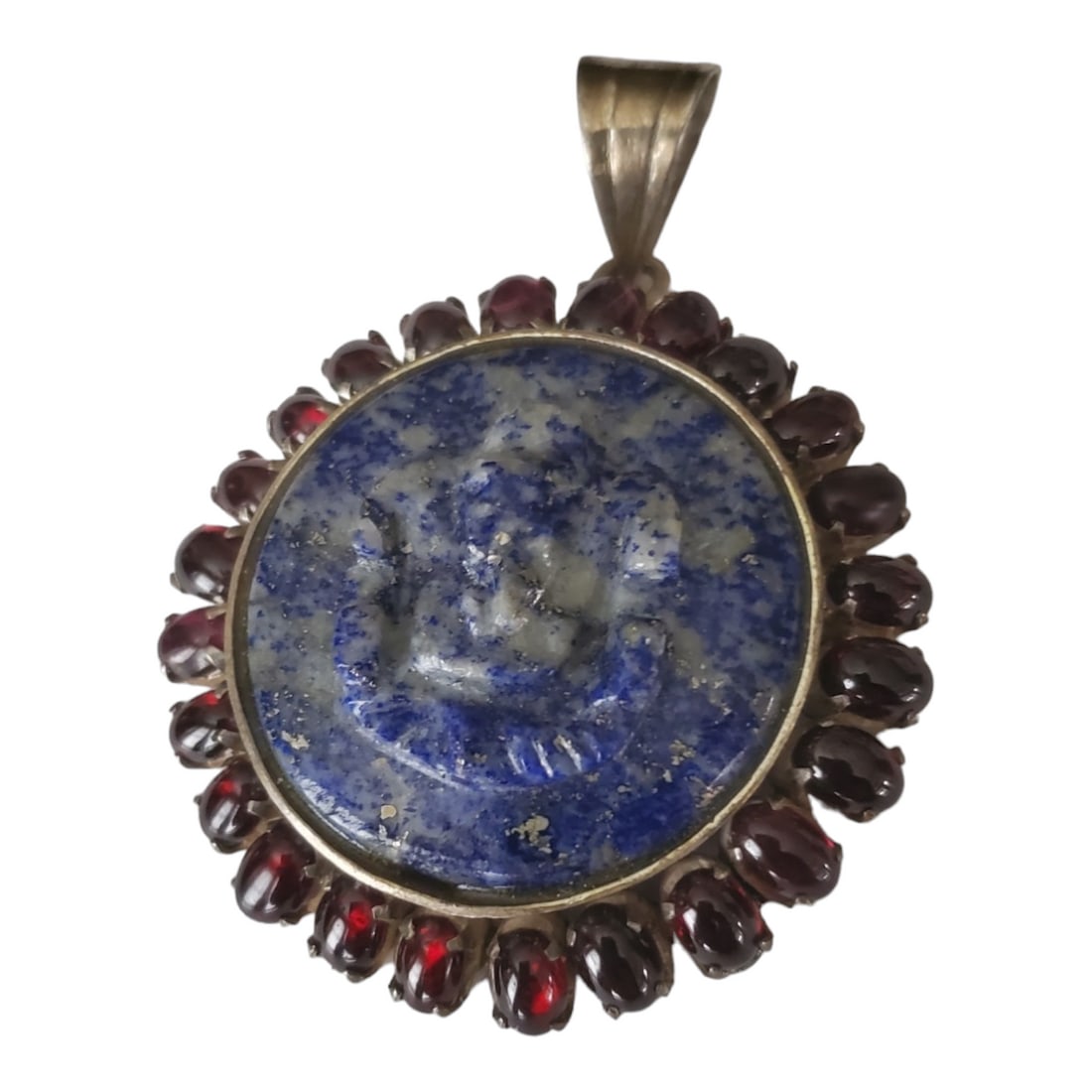 Large Carved Lapis Lazuli Ganesh Medallion Surrounded by Ruby or Garnet Cabochons: Vintage Ganesh / Ganesha Carved Lapis Lazuli Pendant or Medallion with Ruby Cabochons For your consideration is a carved sodalite pendant depicting Ganesh, a well-loved Hindu deity. Ganesh is widely k