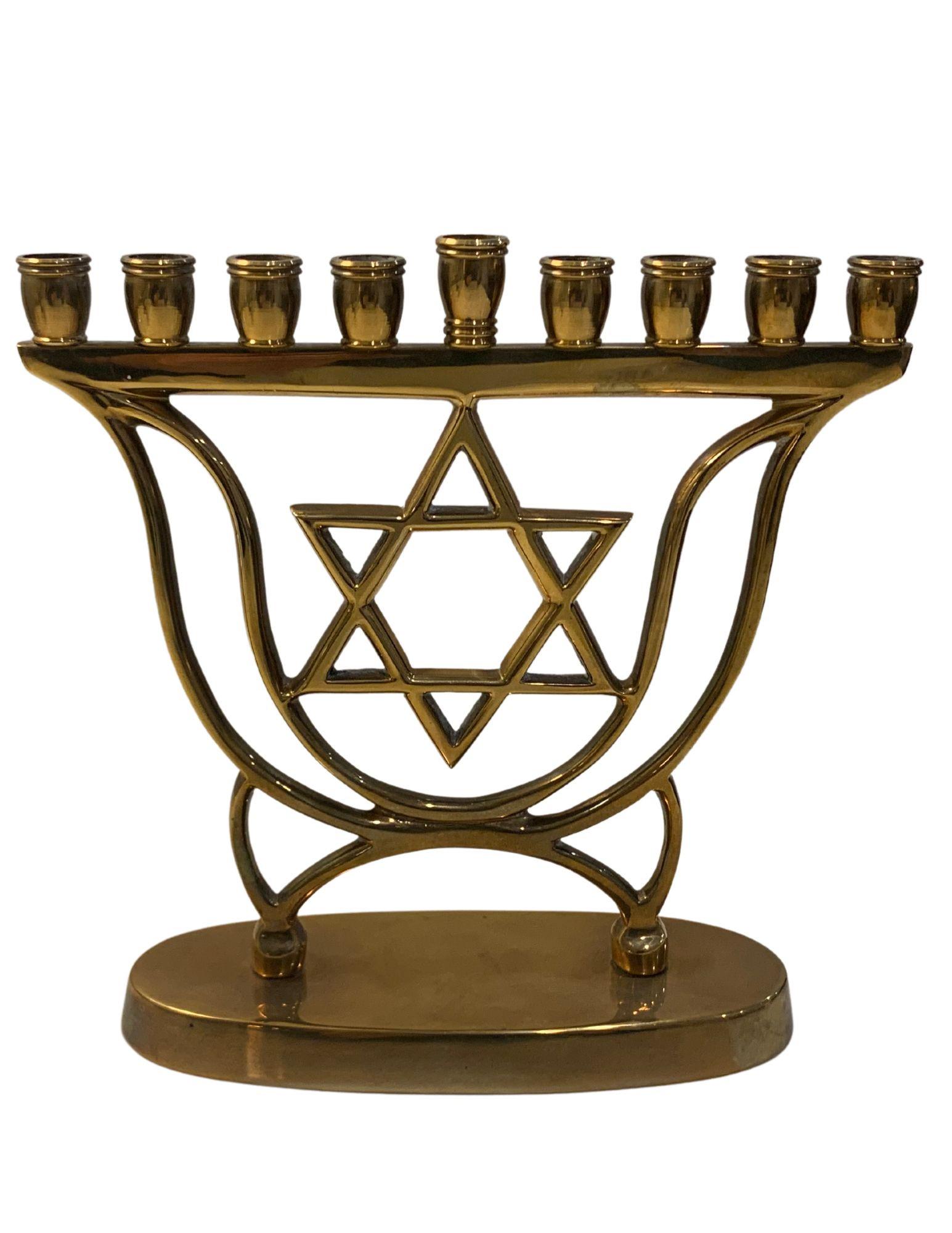 Menorah Star of David: A Brass Hanukkah Menorah with Star of David in Center. Front and Back are Identical. 6 x 5 ½ Inches.