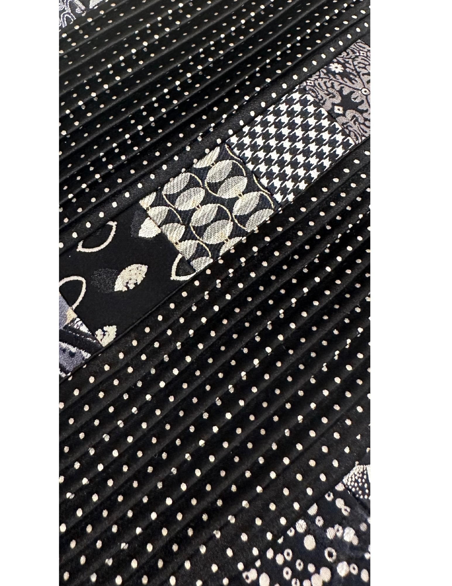 BRIONI, Tie, Pleated, Patchwork, Multicolor, Handmade, Silk: Brand: Brioni, Italy, Handmade Color: Black/Silver (Color appearance/shade can vary due to lighting, monitors, etc.) Pattern: Pleated with Patchwork Material: 100% Silk Width: 3 3/4 inch (9cm) Eligibl