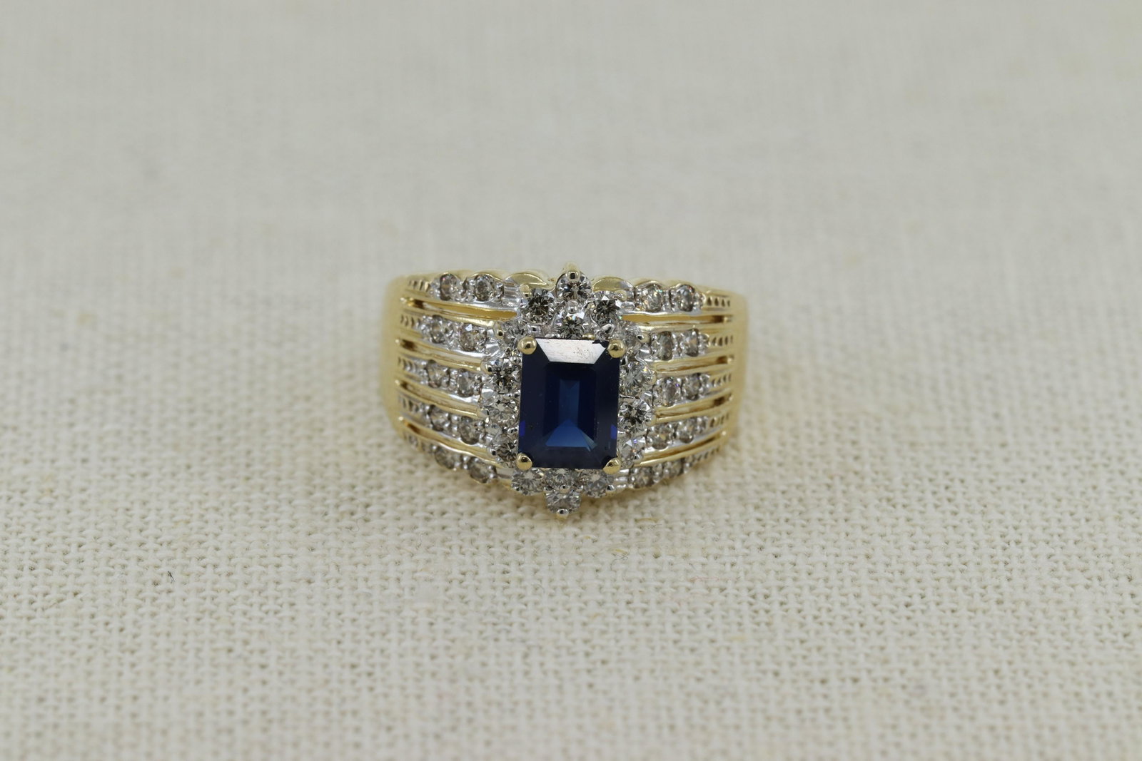 Lady's LeVian 1.50 Carat Emerald Cut Sapphire, 1.0: Lady's LeVian 1.50 Carat Emerald Cut Sapphire, 1.0 Carat Round Cut Diamond and 18 Karat Yellow Gold Ring. Sapphire with Vivid Saturation of Color, Diamonds G Color, SI Clarity. Signed 18K Levian. Very