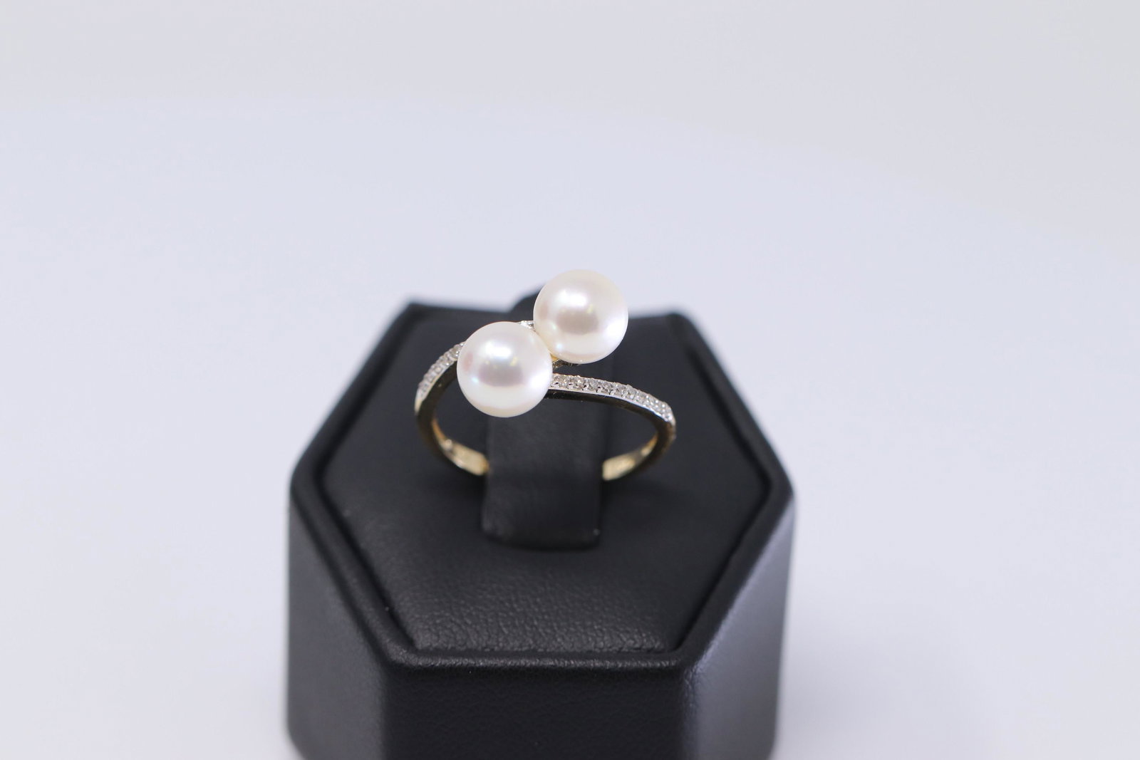 14Kt Ladies Yellow Diamond /Akoya Pearl Ring: A ladies 14kt Yellow Gold Diamond ring. Ring has 2 Akoya Pearls and round diamonds set on the sides. Diamonds weight 0.12ctw. Ring size: 6.75.